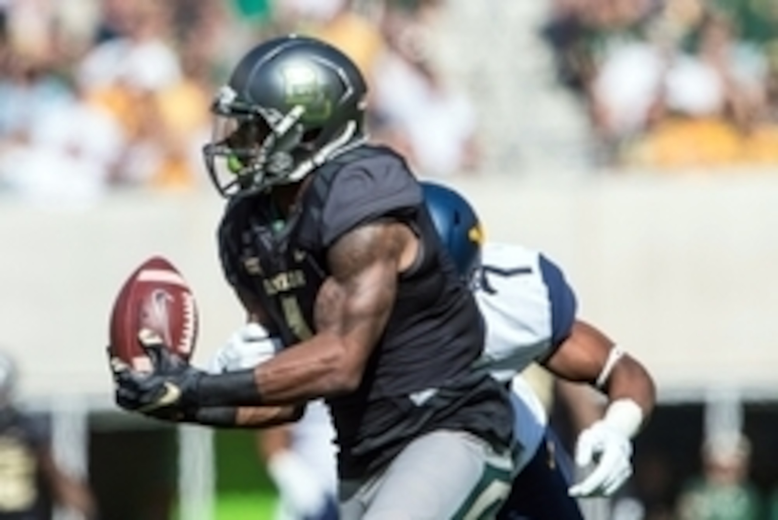 Oct 17, 2015; Waco, TX, USA; Baylor Bears wide receiver Corey Coleman (1) catches a pass as West Virginia Mountaineers cornerback Daryl Worley (7) defends during the first quarter at McLane Stadium. Mandatory Credit: Jerome Miron-USA TODAY Sports