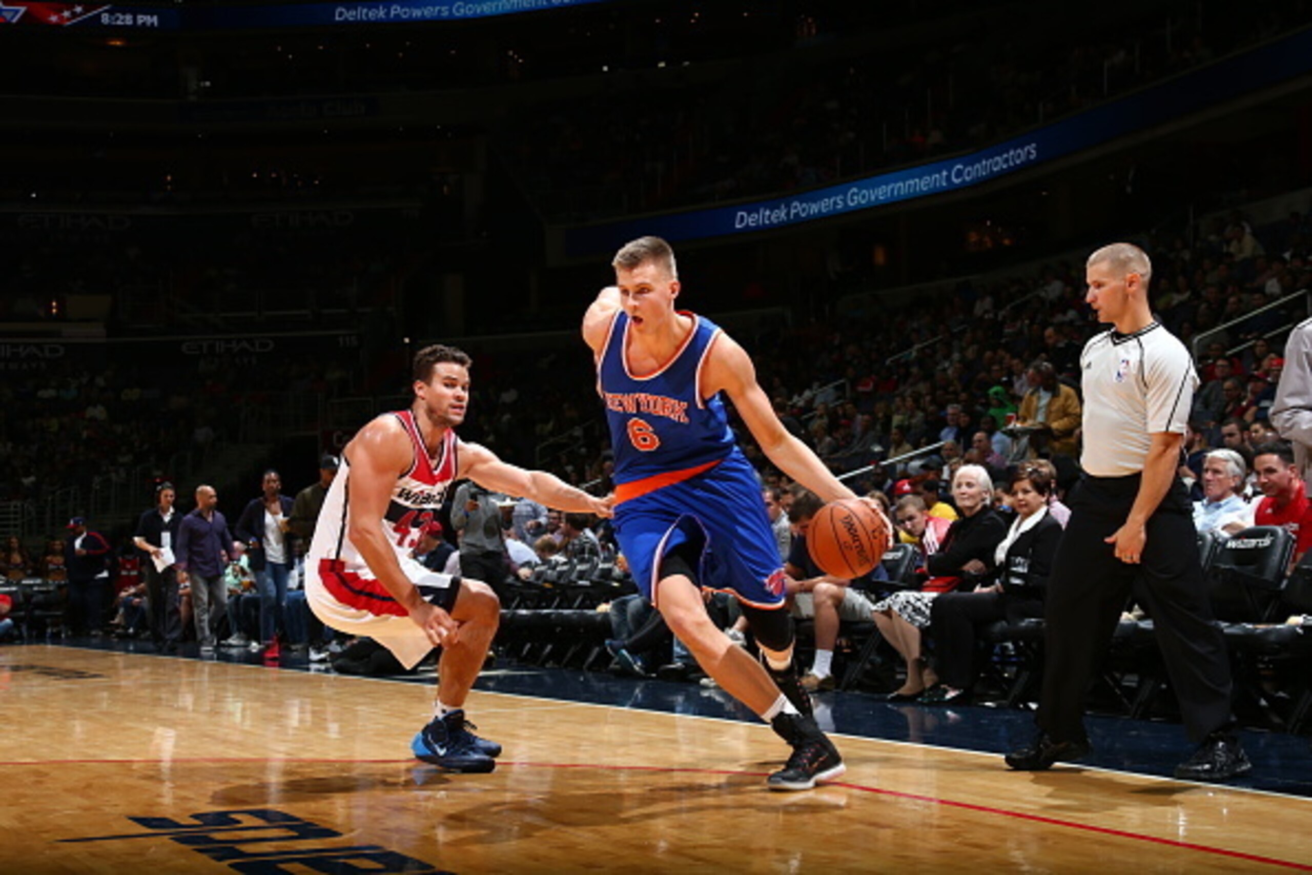WASHINGTON, DC -  OCTOBER 9:  Kristaps Porzingis #6 of the New York Knicks drives to the basket against Kris Humphries #43 of the Washington Wizards during a preseason game on October 9, 2015 at Verizon Center in Washington, DC. NOTE TO USER: User express