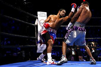 FAIRFAX, VA - OCTOBER 17: Felix Diaz Jr. punches Lamont Peterson during their welterweight bout on the campus of George Mason University on October 17, 2015 in Fairfax, Virginia. Peterson won on judges decision. (Photo by Patrick Smith/Getty Images)