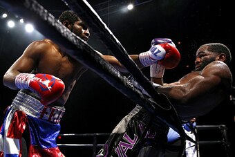 FAIRFAX, VA - OCTOBER 17: Felix Diaz Jr. punches Lamont Peterson during their welterweight bout on the campus of George Mason University on October 17, 2015 in Fairfax, Virginia. Peterson won on judges decision. (Photo by Patrick Smith/Getty Images)