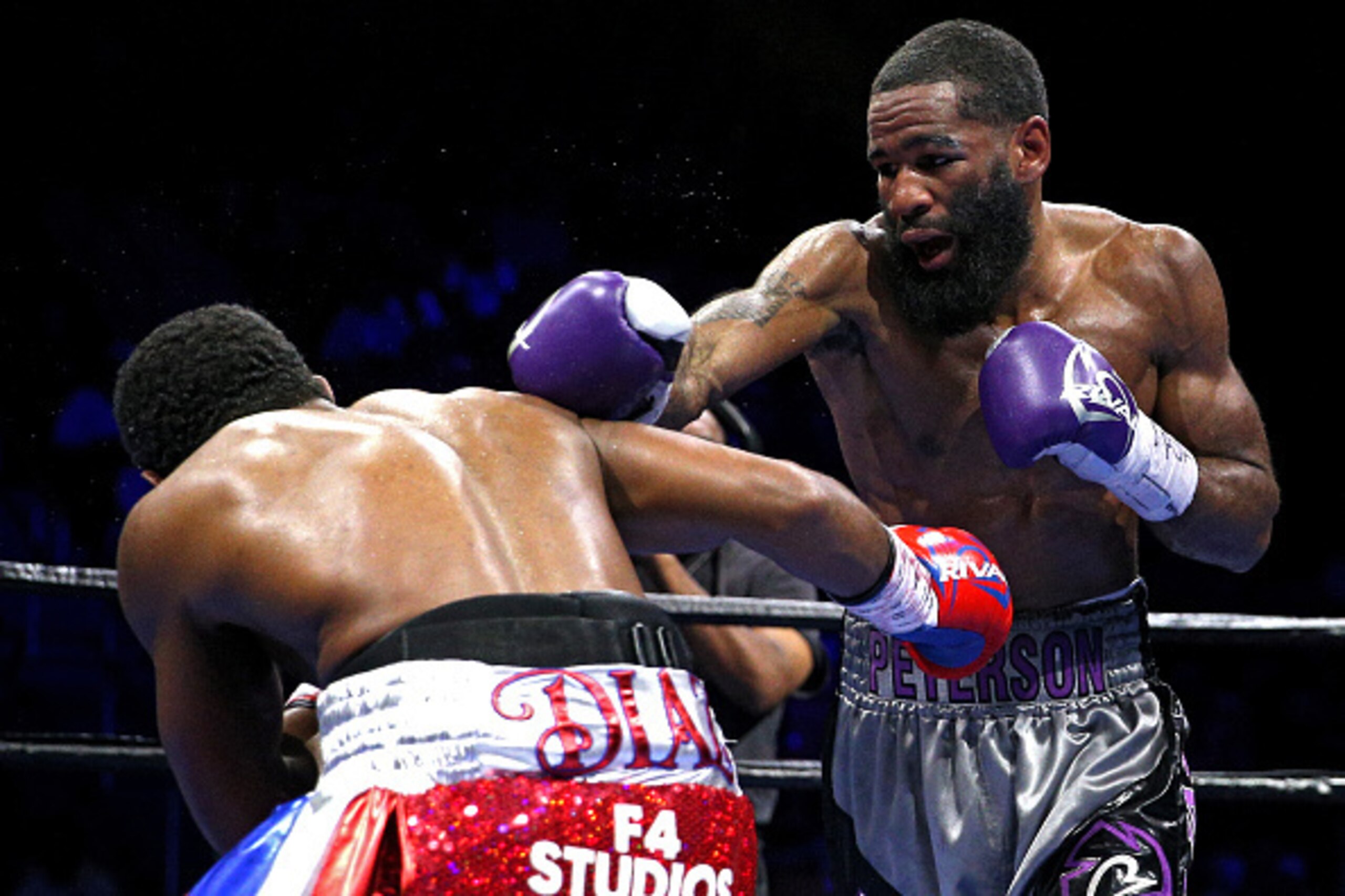FAIRFAX, VA - OCTOBER 17: Lamont Peterson punches Felix Diaz Jr. during their welterweight bout on the campus of George Mason University on October 17, 2015 in Fairfax, Virginia. Peterson won on judges decision. (Photo by Patrick Smith/Getty Images)