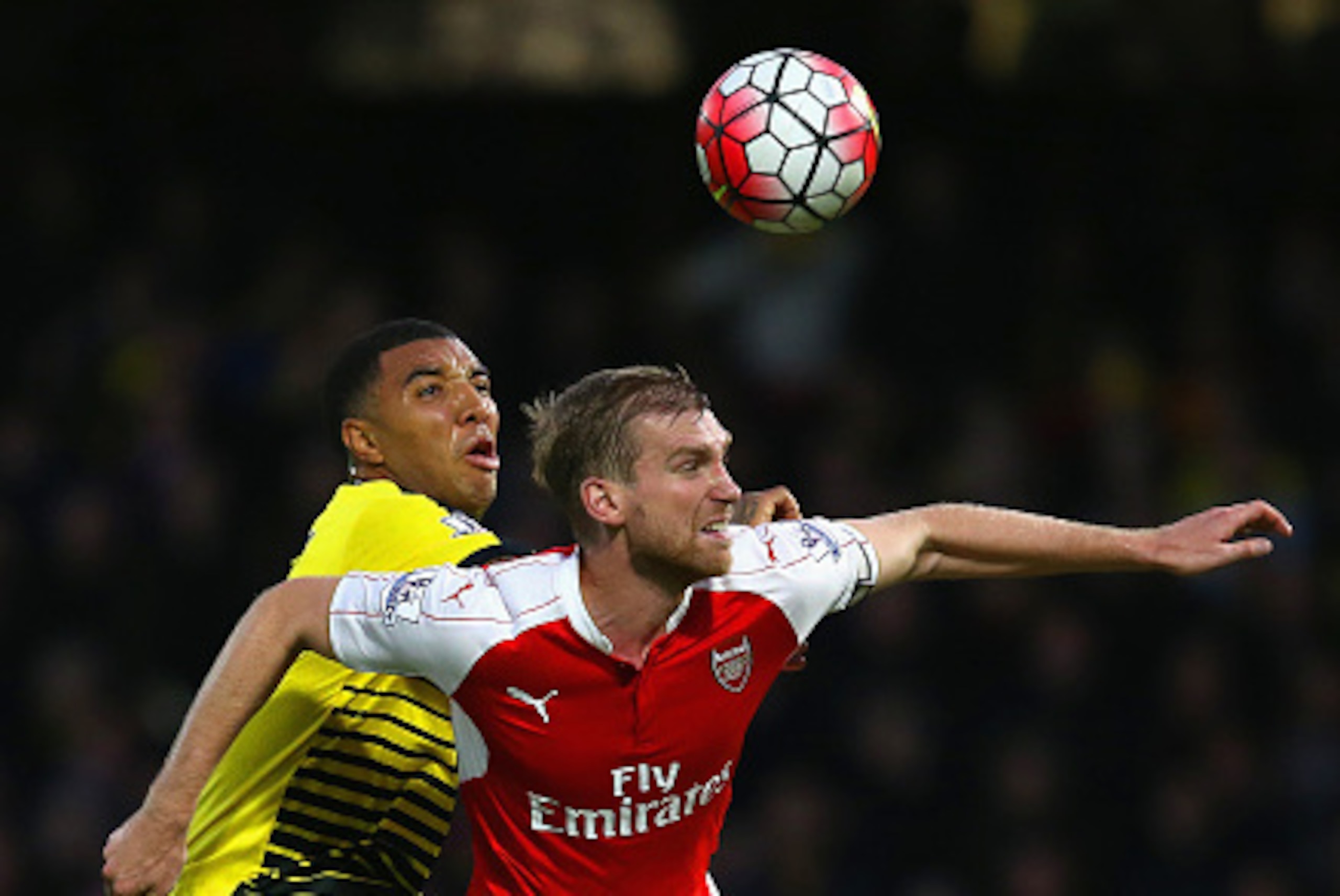 WATFORD, ENGLAND - OCTOBER 17: Per Mertesacker of Arsenal holds off Troy Deeney of Watford during the Barclays Premier League match between Watford and Arsenal at Vicarage Road on October 17, 2015 in Watford, England. (Photo by Jan Kruger/Getty Images) WATFORD, ENGLAND - OCTOBER 17: Per Mertesacker of Arsenal holds off Troy Deeney of Watford during the Barclays Premier League match between Watford and Arsenal at Vicarage Road on October 17, 2015 in Watford, England. (Photo by Jan Kruger/Getty Images)