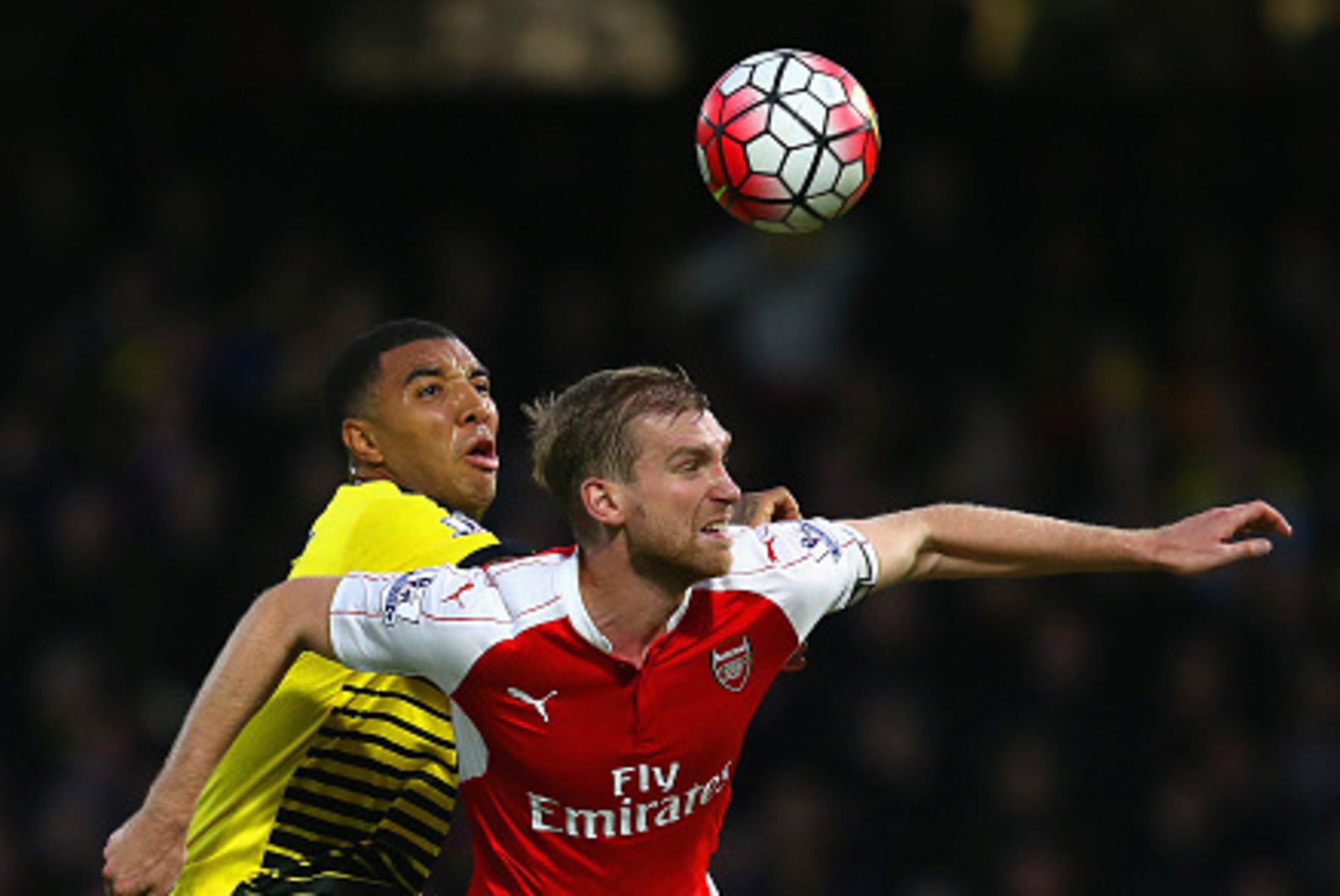 WATFORD, ENGLAND - OCTOBER 17:  Per Mertesacker of Arsenal holds off Troy Deeney of Watford during the Barclays Premier League match between Watford and Arsenal at Vicarage Road on October 17, 2015 in Watford, England.  (Photo by Jan Kruger/Getty Images)