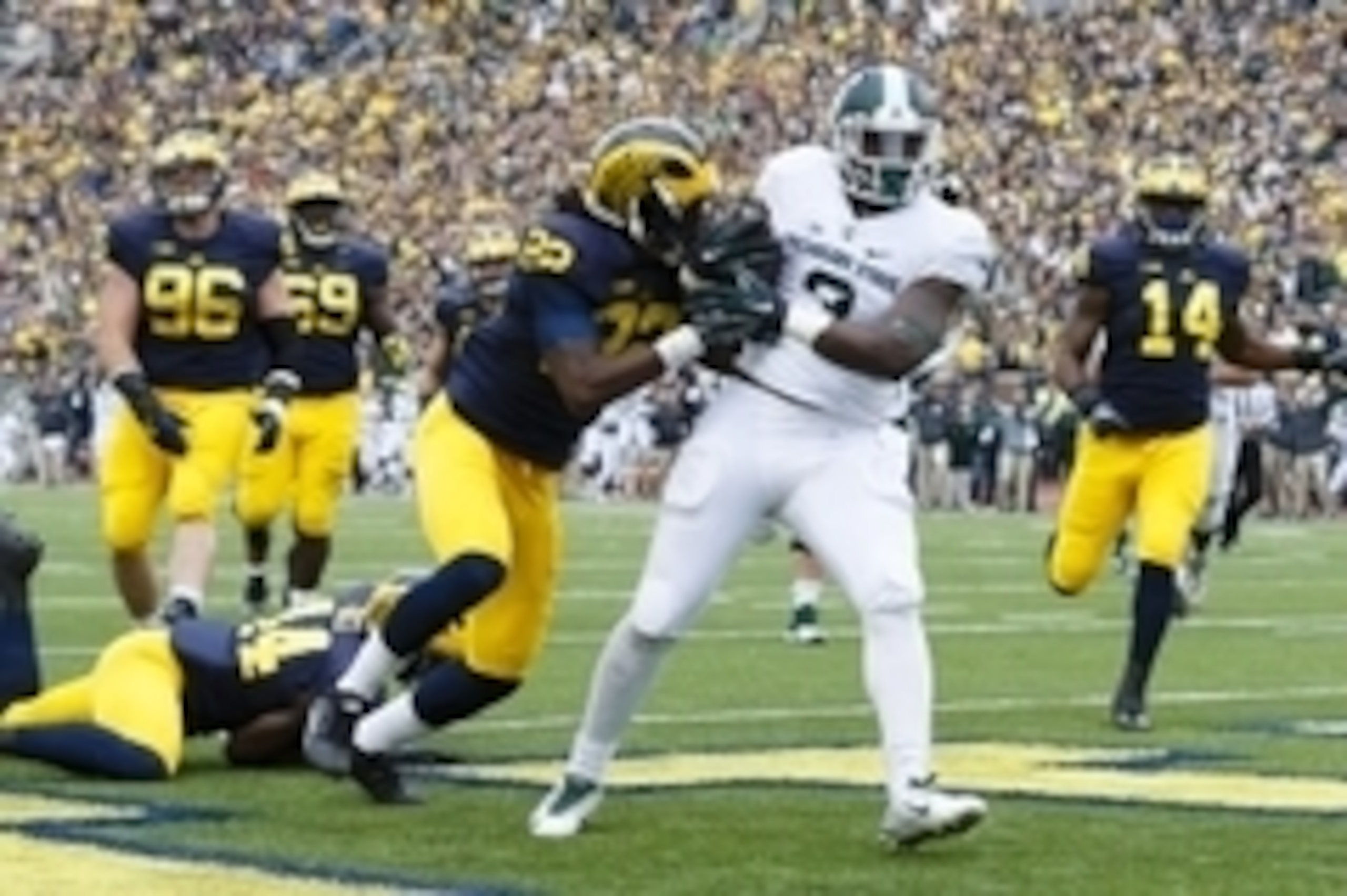Oct 17, 2015; Ann Arbor, MI, USA; Michigan State Spartans running back LJ Scott (3) rushes for a touchdown in the first half against the Michigan Wolverines at Michigan Stadium. Mandatory Credit: Rick Osentoski-USA TODAY Sports