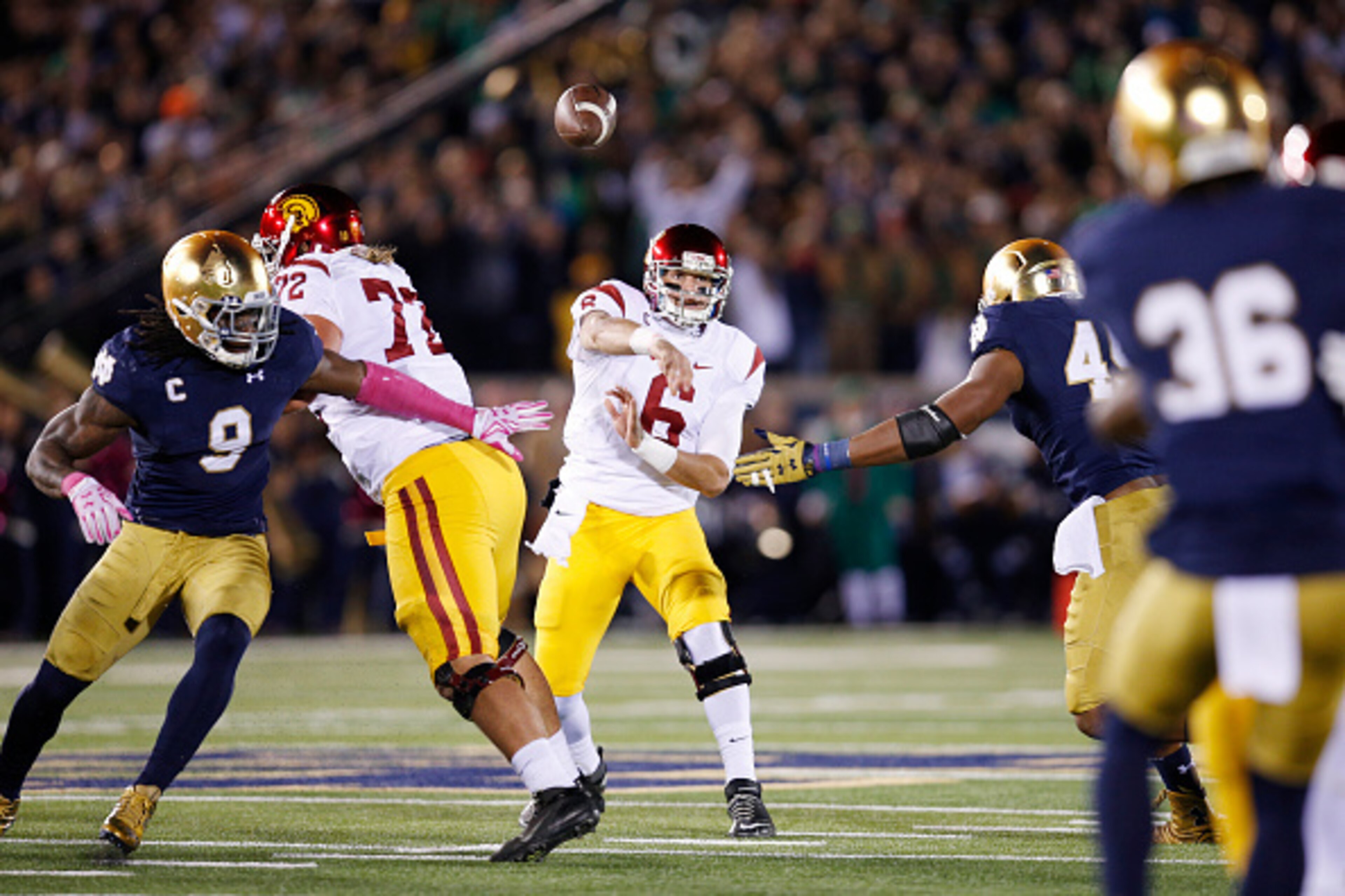 SOUTH BEND, IN - OCTOBER 17: Cody Kessler #6 of the USC Trojans passes while under pressure against the Notre Dame Fighting Irish in the first half of the game at Notre Dame Stadium on October 17, 2015 in South Bend, Indiana. (Photo by Joe Robbins/Getty I