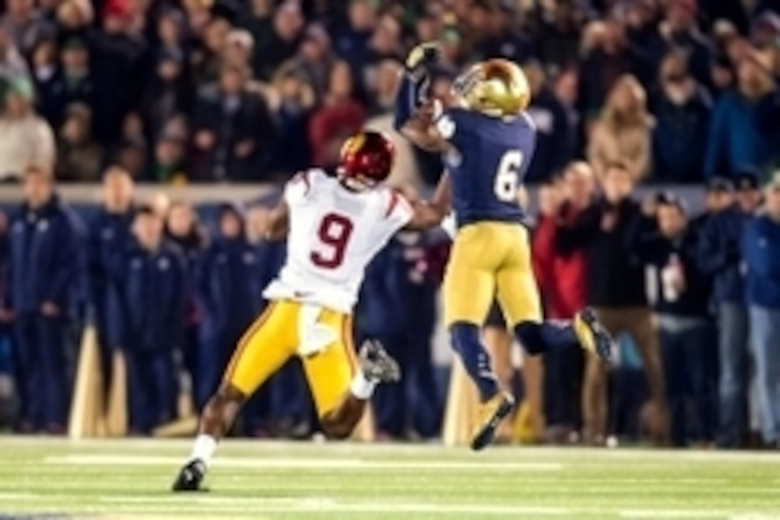Oct 17, 2015; South Bend, IN, USA; Notre Dame Fighting Irish cornerback KeiVarae Russell (6) intercepts a pass intended for USC Trojans wide receiver JuJu Smith-Schuster (9) in the fourth quarter at Notre Dame Stadium. Notre Dame won 41-31. Mandatory Cred
