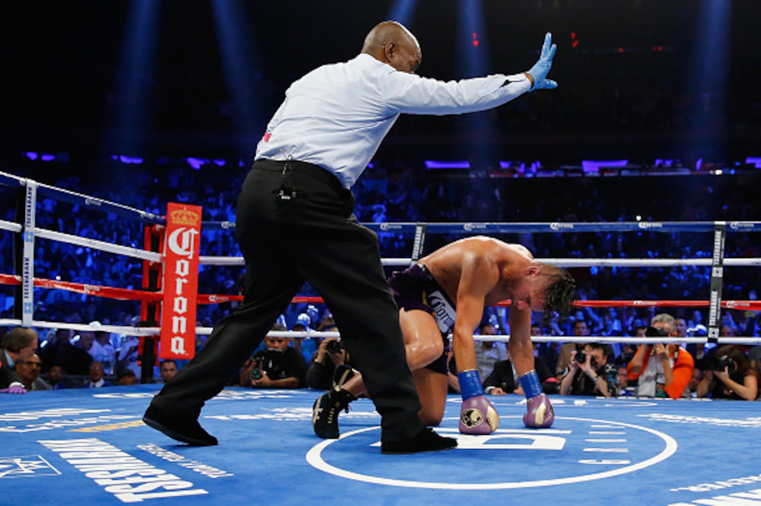 NEW YORK, NY - OCTOBER 17:  Gennady Golovkin knocks down  David Lemieux during their WBA/WBC interim/IBF middleweight title unification bout at Madison Square Garden on October 17, 2015 in New York City.  (Photo by Al Bello/Getty Images)