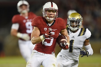 STANFORD, CA - OCTOBER 15:  Christian McCaffrey #5 of the Stanford Cardinal's rushes for a twenty eight yard touchdown run against the UCLA Bruins in the second quarter of an NCAA football game at Stanford Stadium on October 15, 2015 in Stanford, Californ
