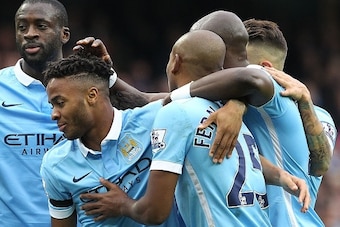 Manchester City's English midfielder Raheem Sterling (2nd L) celebrates with teammates after scoring the opening goal of the English Premier League football match between Manchester City and Bournemouth at the Etihad Stadium in Manchester, northwest Engla