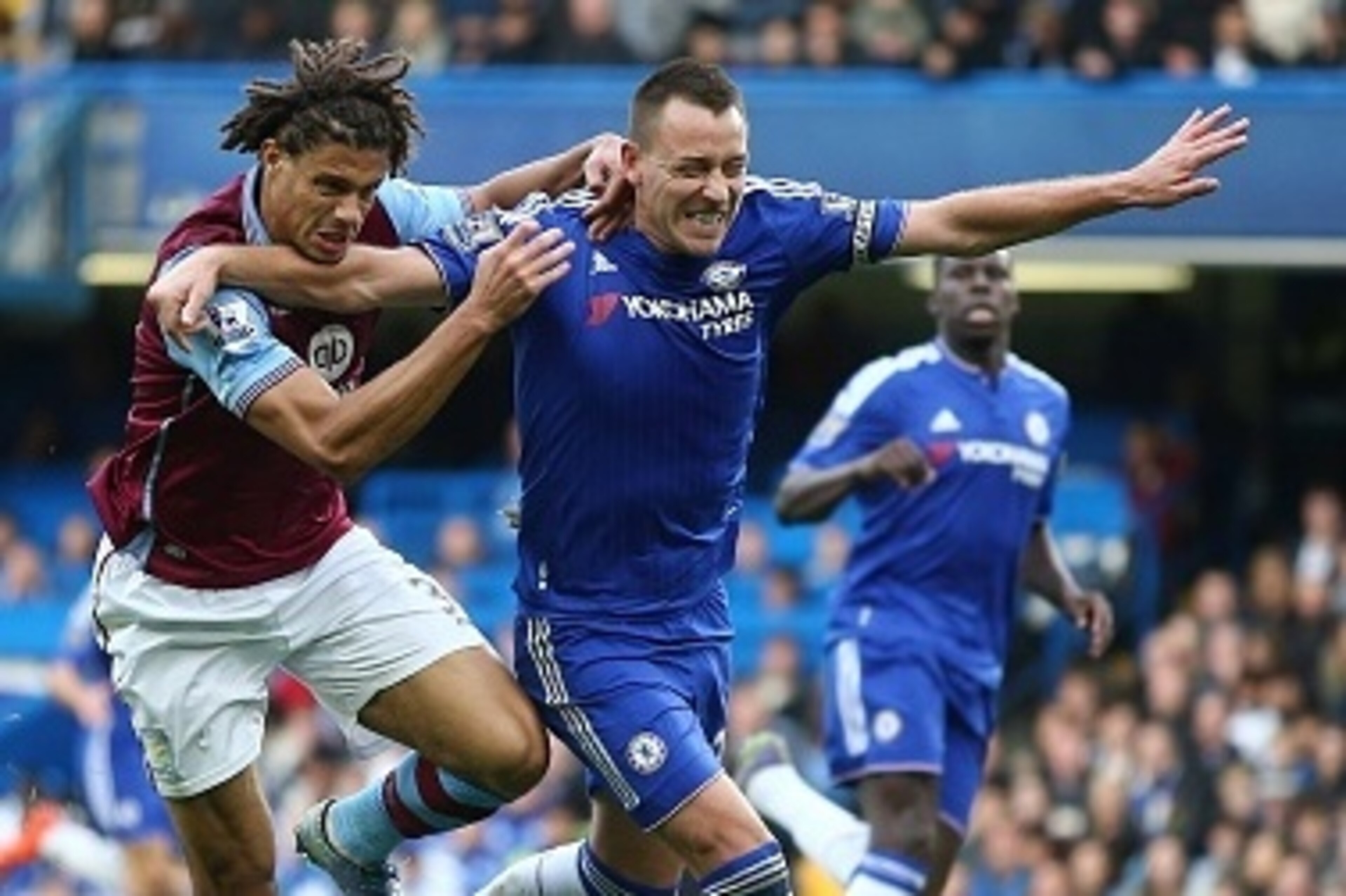Aston Villa's Benin striker Rudy Gestede (L) vies for the ball with Chelsea's English defender John Terry during the English Premier League football match between Chelsea and Aston Villa at Stamford Bridge in London, on October 17, 2015. AFP PHOTO / JUSTI