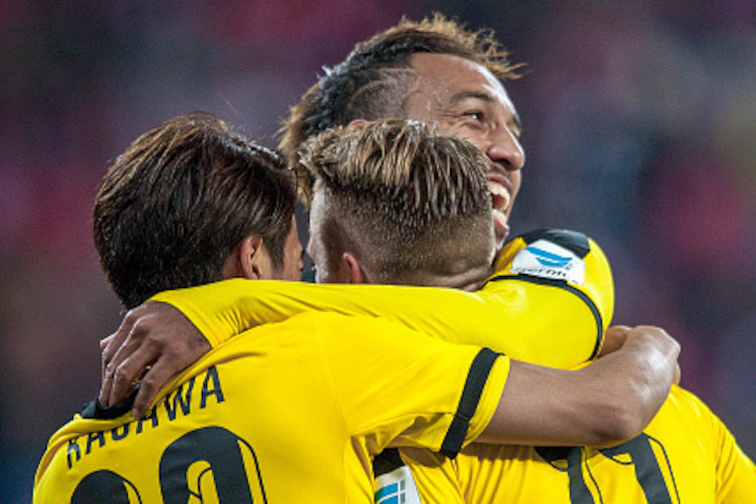 MAINZ, GERMANY - OCTOBER 16: Midfielder Marco Reus (11) of Borussia Dortmund, Midfielder Shinji Kagawa (23) of Borussia Dortmund and Forward Pierre-Emerick Aubameyang (17) of Borussia Dortmund celebrating after the first goal at Coface Arena on October 16 MAINZ, GERMANY - OCTOBER 16: Midfielder Marco Reus (11) of Borussia Dortmund, Midfielder Shinji Kagawa (23) of Borussia Dortmund and Forward Pierre-Emerick Aubameyang (17) of Borussia Dortmund celebrating after the first goal at Coface Arena on October 16