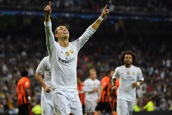 Real Madrid's Portuguese forward Cristiano Ronaldo celebrates a goal during the UEFA Champions League group A football match Real Madrid CF vs FC Shakhtar Donetsk at the Santiago Bernabeu stadium in Madrid on September 15, 2015. AFP PHOTO/ PIERRE-PHILIPPE