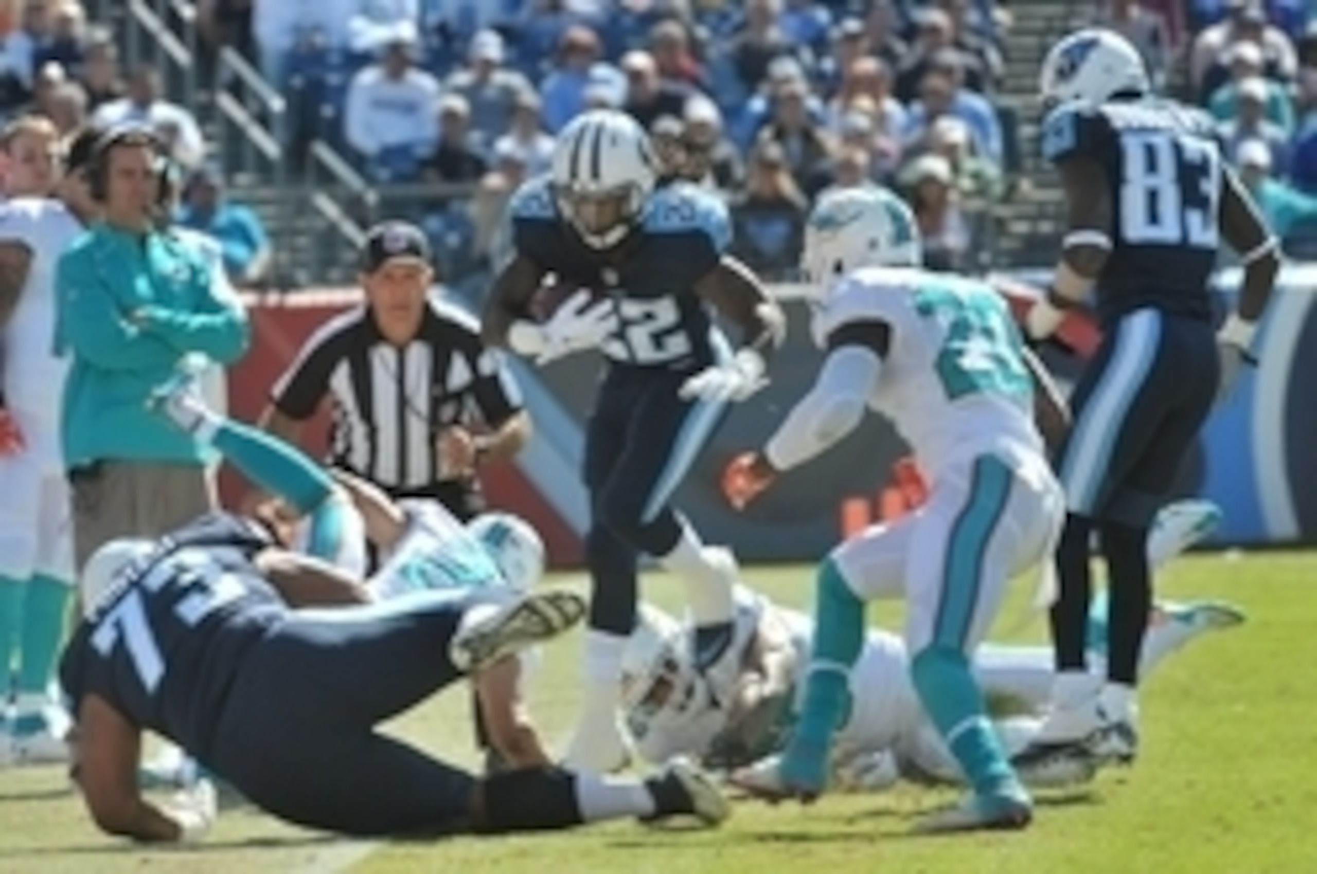 Oct 18, 2015; Nashville, TN, USA; Tennessee Titans running back Dexter McCluster (22) leaps to avoid a tackle against the Miami Dolphins during the first half at Nissan Stadium. Mandatory Credit: Jim Brown-USA TODAY Sports Oct 18, 2015; Nashville, TN, USA; Tennessee Titans running back Dexter McCluster (22) leaps to avoid a tackle against the Miami Dolphins during the first half at Nissan Stadium. Mandatory Credit: Jim Brown-USA TODAY Sports