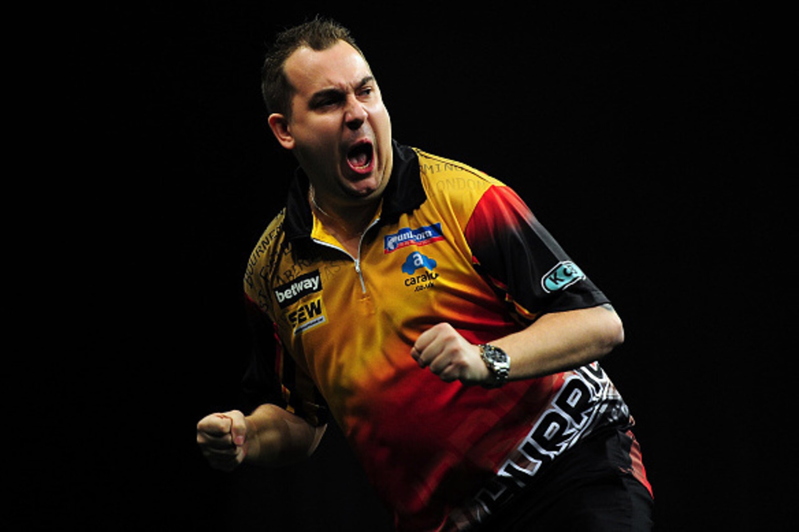EXETER, ENGLAND - MARCH 05:  Kim Huybrechts of Belgium celebrates beating Raymond van Barneveld of Holland during The Betway Premier League Darts at Westpoint Arena on March 5, 2015 in Exeter, England.  (Photo by Dan Mullan/Getty Images)