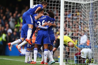 LONDON, ENGLAND - OCTOBER 17: Chelsea players celebrate their team's first goal by Diego Costa (obscured) during the Barclays Premier League match between Chelsea and Aston Villa at Stamford Bridge on October 17, 2015 in London, England.  (Photo by Clive 