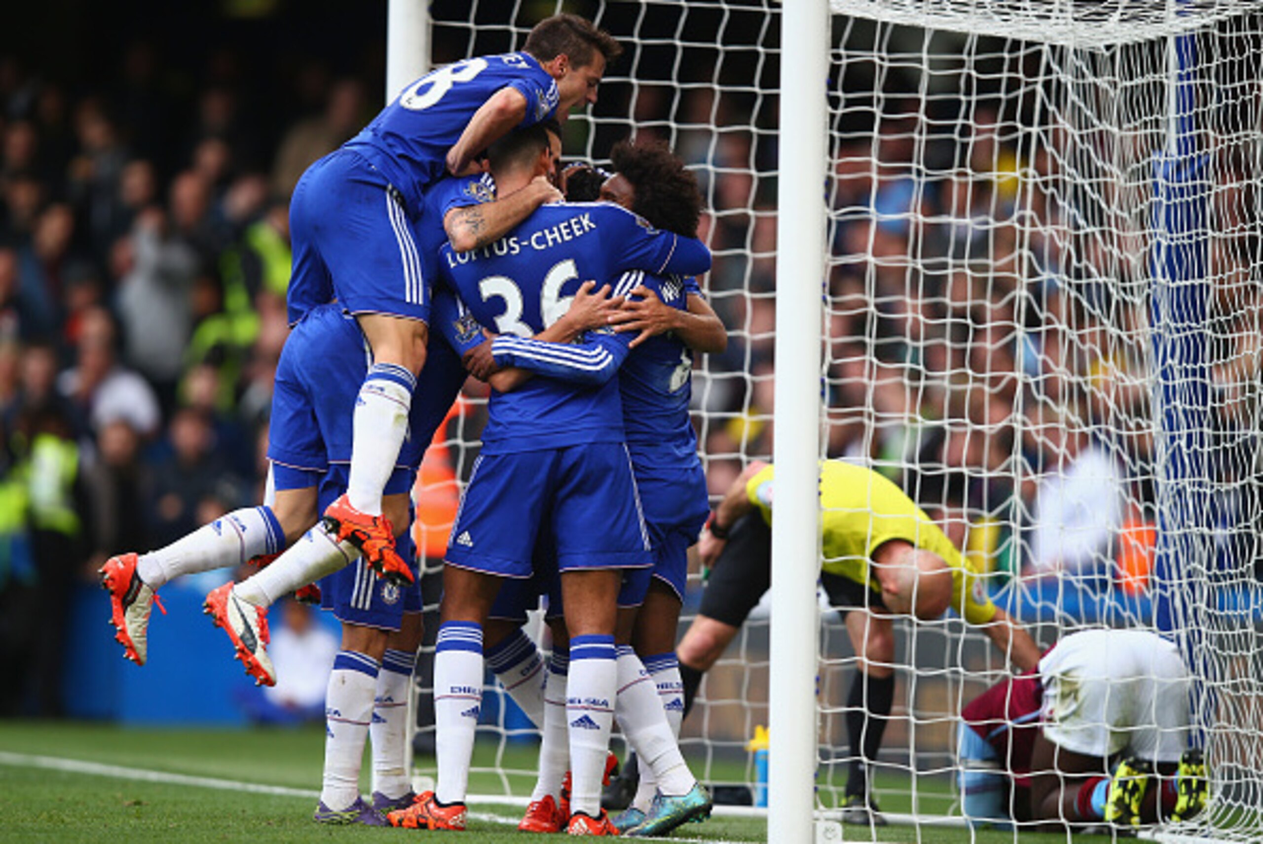 LONDON, ENGLAND - OCTOBER 17: Chelsea players celebrate their team's first goal by Diego Costa (obscured) during the Barclays Premier League match between Chelsea and Aston Villa at Stamford Bridge on October 17, 2015 in London, England.  (Photo by Clive 