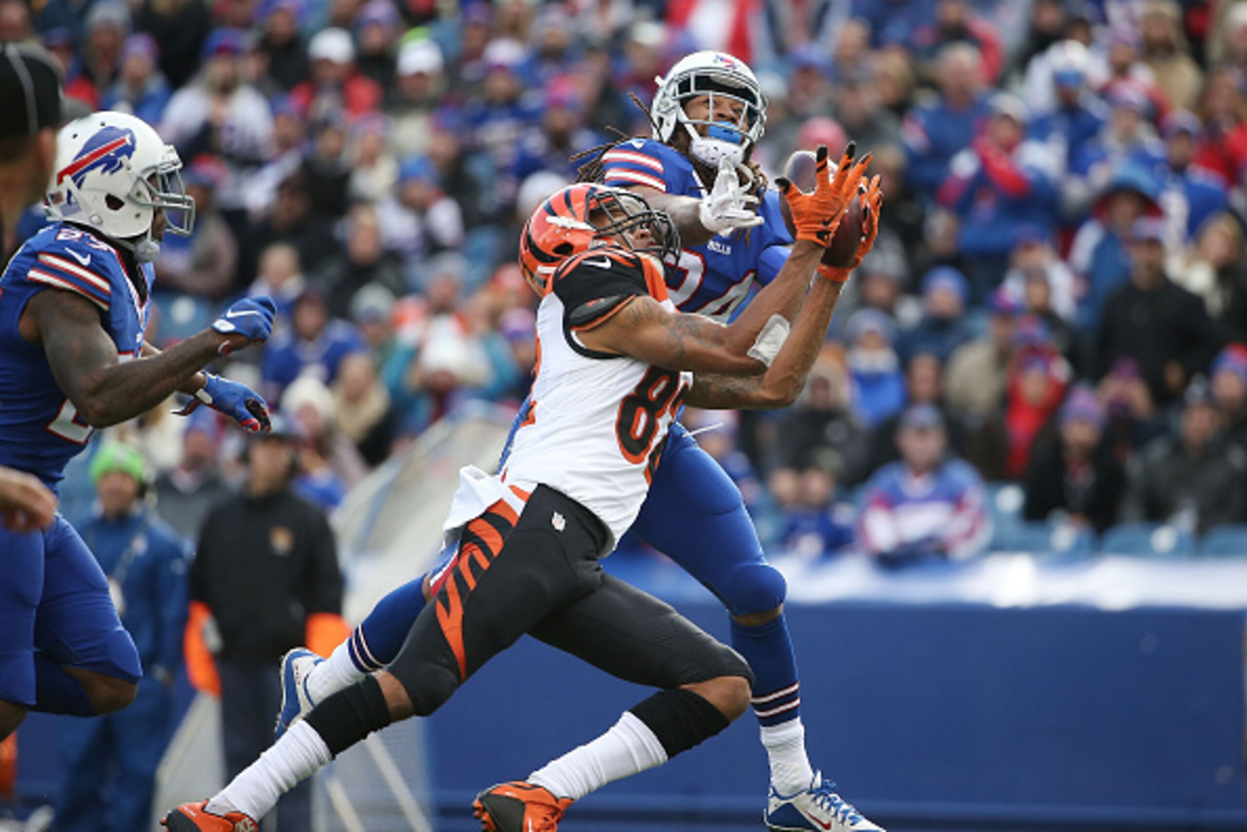ORCHARD PARK, NY - OCTOBER 18:  Marvin Jones #82 of the Cincinnati Bengals makes a catch through the hands of Stephon Gilmore #24 of the Buffalo Bills  during the second half at Ralph Wilson Stadium on October 18, 2015 in Orchard Park, New York.  (Photo b