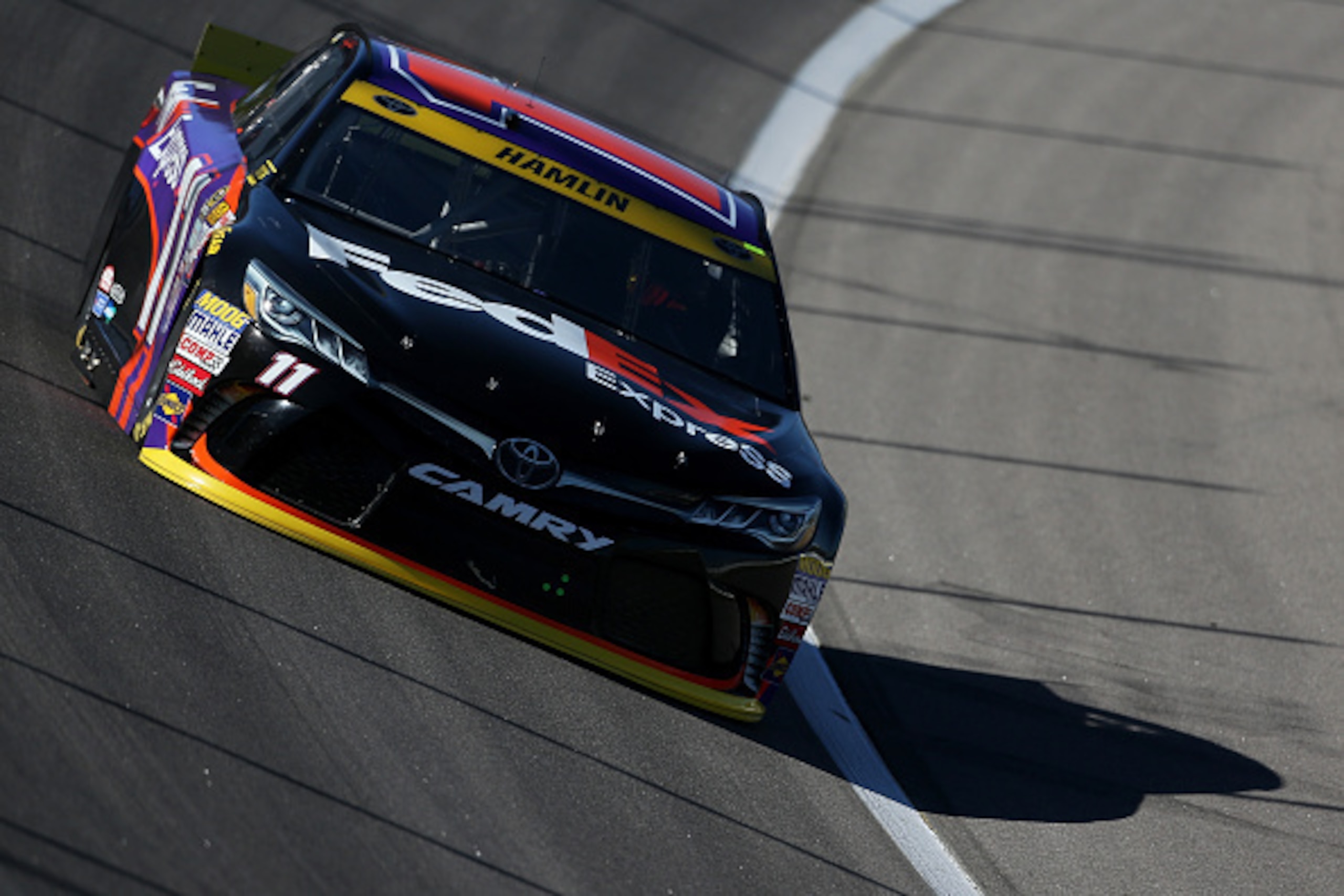 KANSAS CITY, KS - OCTOBER 16: Denny Hamlin, driver of the #11 FedEx Express Toyota, practices for the NASCAR Sprint Cup Series Hollywood Casino 400 at Kansas Speedway on October 16, 2015 in Kansas City, Kansas.  (Photo by Todd Warshaw/Getty Images)