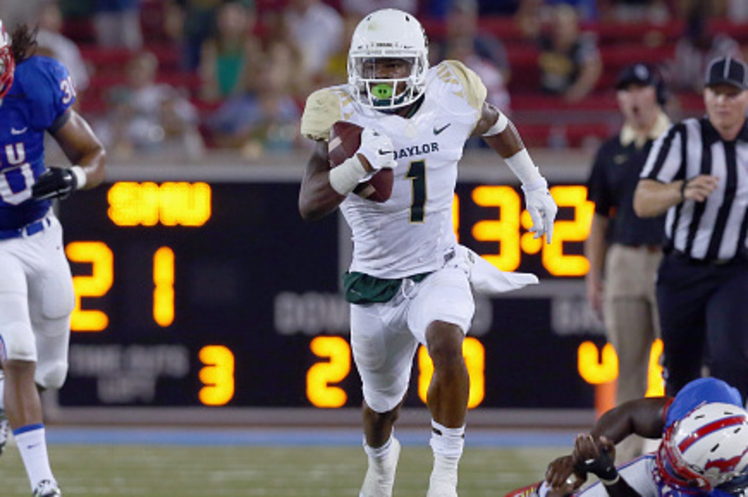 DALLAS, TX - SEPTEMBER 04:  Corey Coleman #1 of the Baylor Bears carries the ball and scores a touchdown against Robert Seals #30 of the Southern Methodist Mustangs and Jonathan Yenga #1 of the Southern Methodist Mustangs in the second half at Gerald J. F