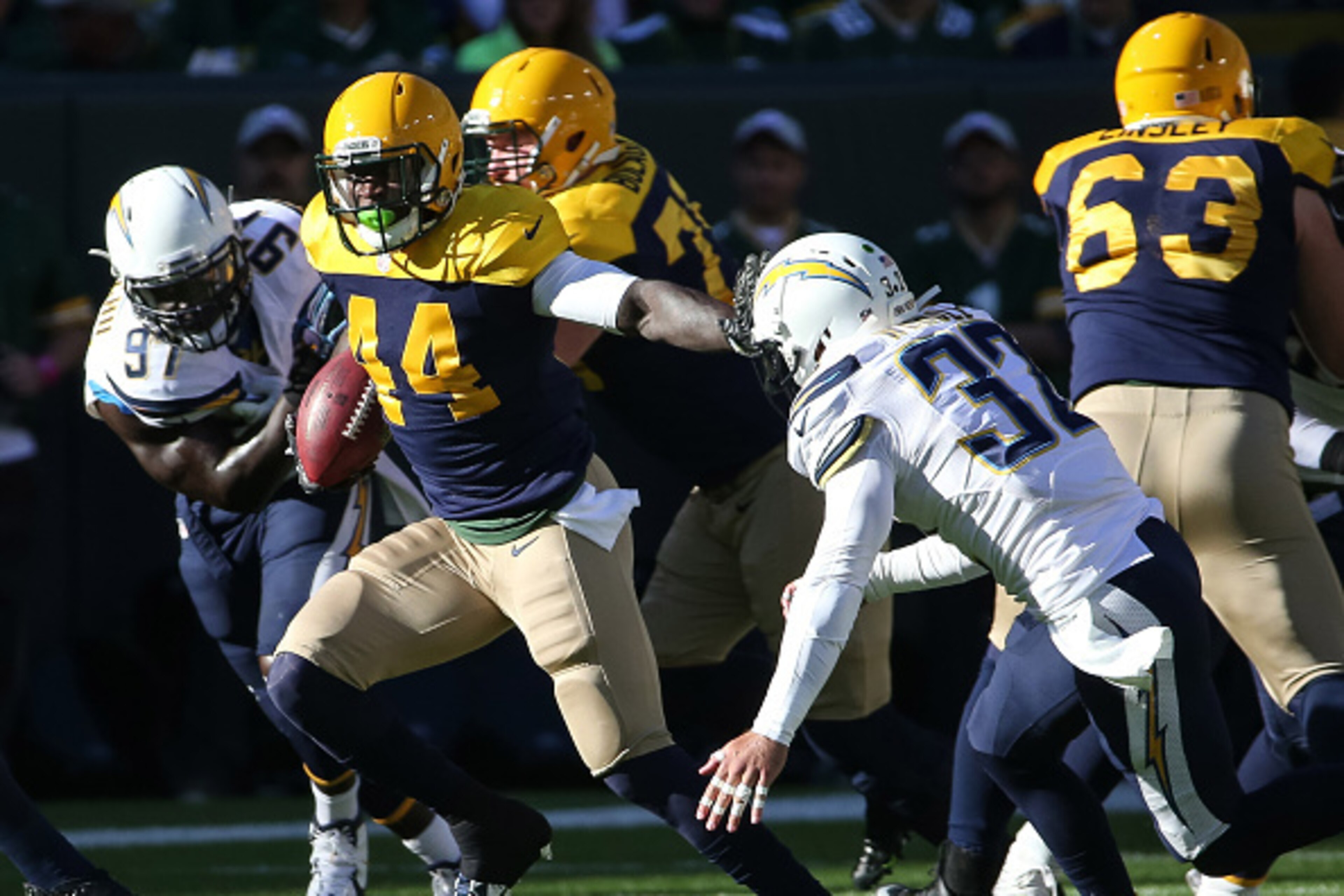 GREEN BAY, WI - OCTOBER 18: James Starks #44 of the Green Bay Packers carries the football against Eric Weddle #32 of the San Diego Chargers in the first quarter at Lambeau Field on October 18, 2015 in Green Bay, Wisconsin. (Photo by Jonathan Daniel/Ge GREEN BAY, WI - OCTOBER 18: James Starks #44 of the Green Bay Packers carries the football against Eric Weddle #32 of the San Diego Chargers in the first quarter at Lambeau Field on October 18, 2015 in Green Bay, Wisconsin. (Photo by Jonathan Daniel/Ge