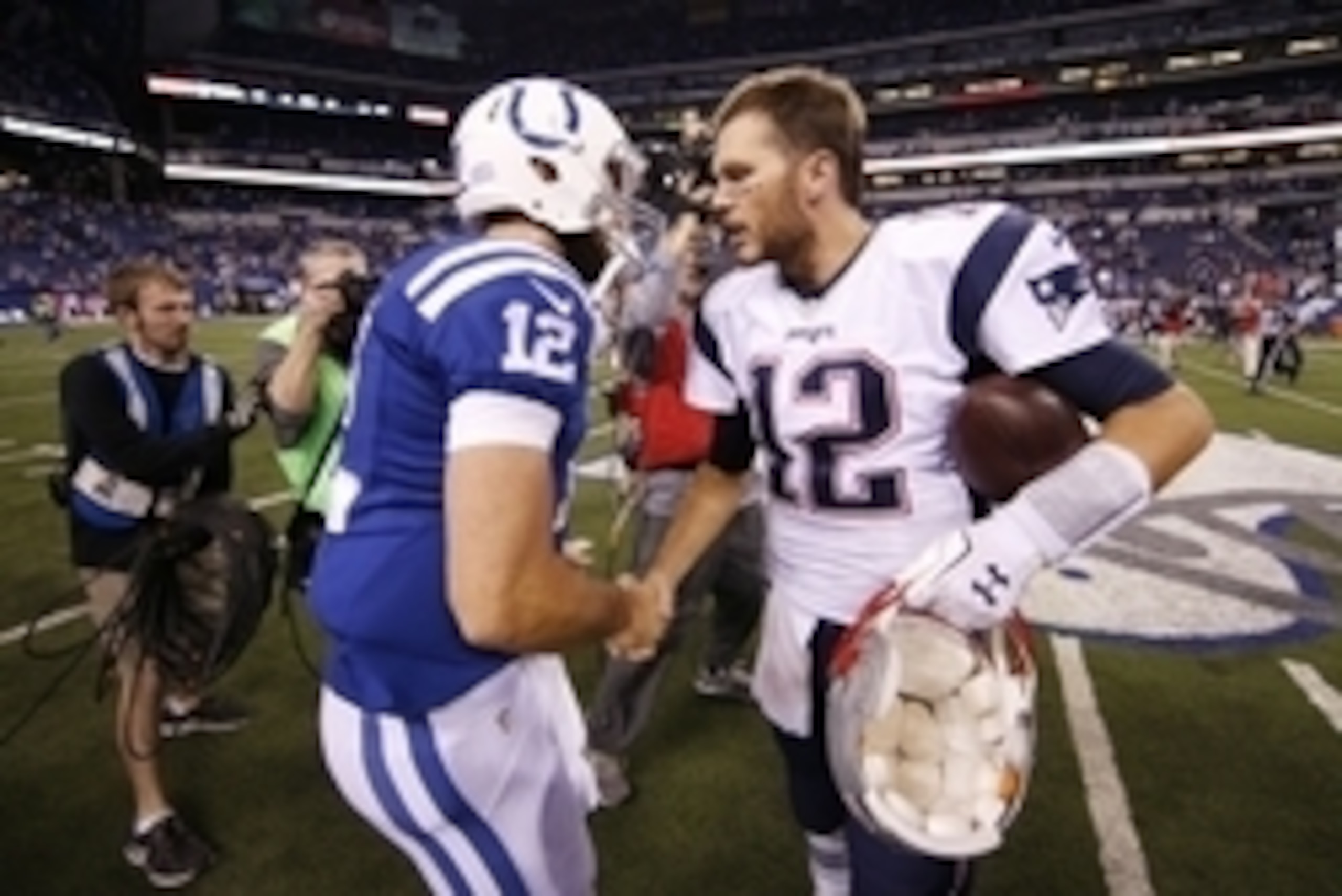 Oct 18, 2015; Indianapolis, IN, USA; Indianapolis Colts quarterback Andrew Luck (left) greets New England Patriots quarterback Tom Brady (right) after the NFL game at Lucas Oil Stadium. Mandatory Credit: Brian Spurlock-USA TODAY Sports