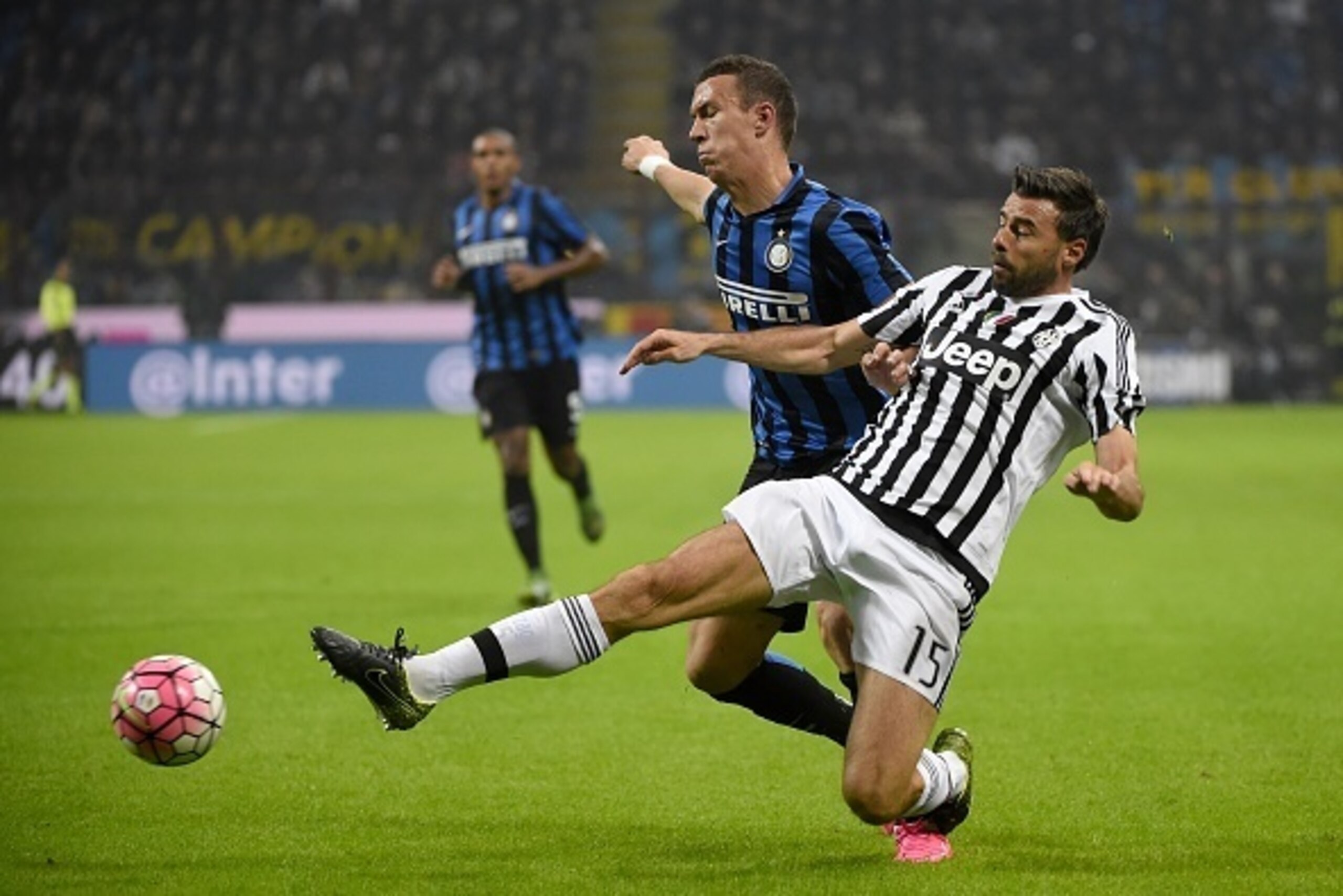 Inter Milan's midfielder from Montenegro Stevan Jovetic (L) fights for the ball with Juventus' defender from Italy Andrea Barzagli during the Italian Serie A football match Inter Milan vs Juventus on October18, 2015 at the San Siro Stadium stadium in Mila