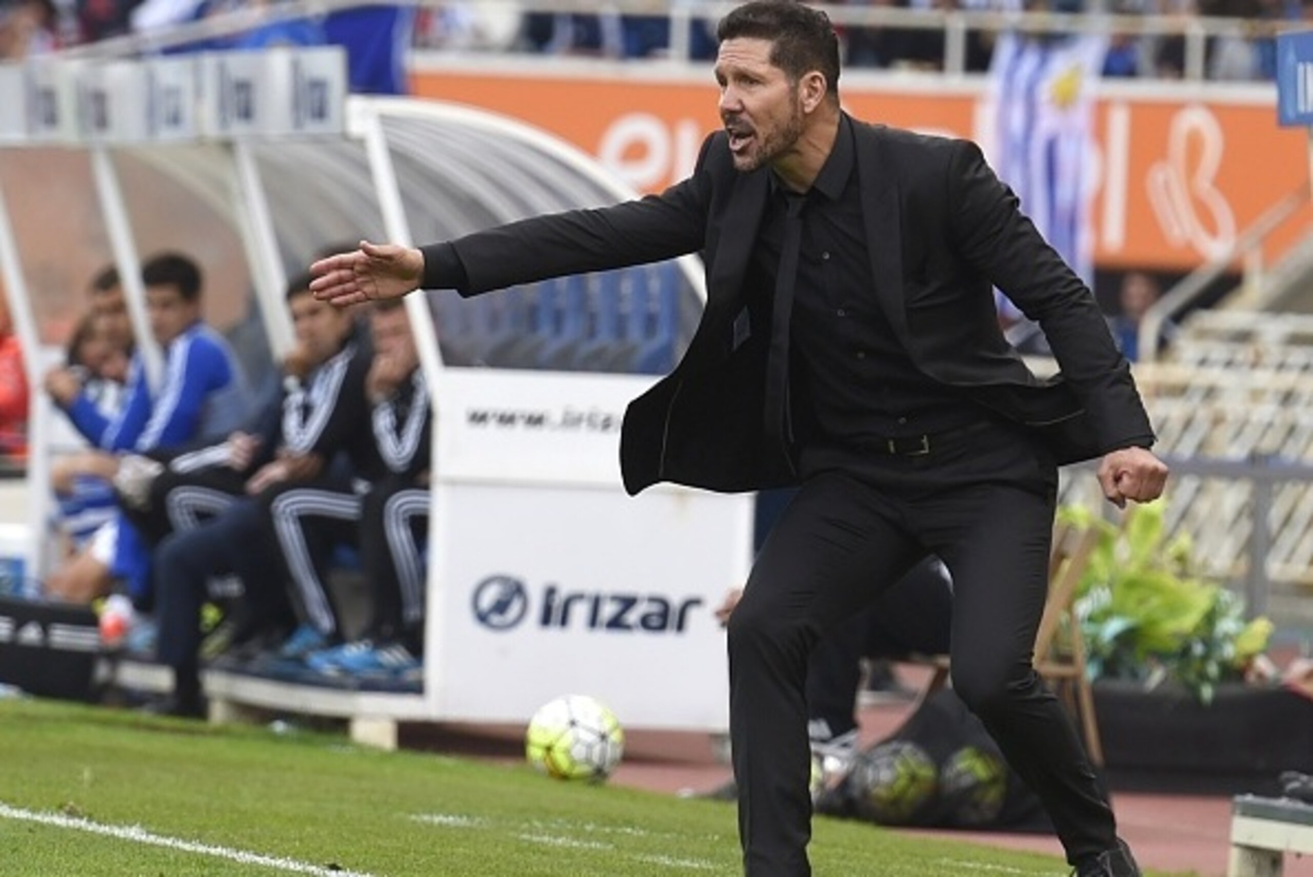 Atletico Madrid's Argentinian coach Diego Simeone reacts on the sideline during the Spanish league football match Real Sociedad de Futbol vs Club Atletico de Madrid at the Anoeta stadium in San Sebastian on October 18, 2015.   AFP PHOTO/ ANDER GILLENEA   
