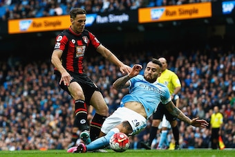 MANCHESTER, ENGLAND - OCTOBER 17: Simon Francis of Bournemouth and Nicolas Otamendi of Manchester City compete for the ball during the Barclays Premier League match between Manchester City and A.F.C. Bournemouth at Etihad Stadium on October 17, 2015 in M MANCHESTER, ENGLAND - OCTOBER 17: Simon Francis of Bournemouth and Nicolas Otamendi of Manchester City compete for the ball during the Barclays Premier League match between Manchester City and A.F.C. Bournemouth at Etihad Stadium on October 17, 2015 in M