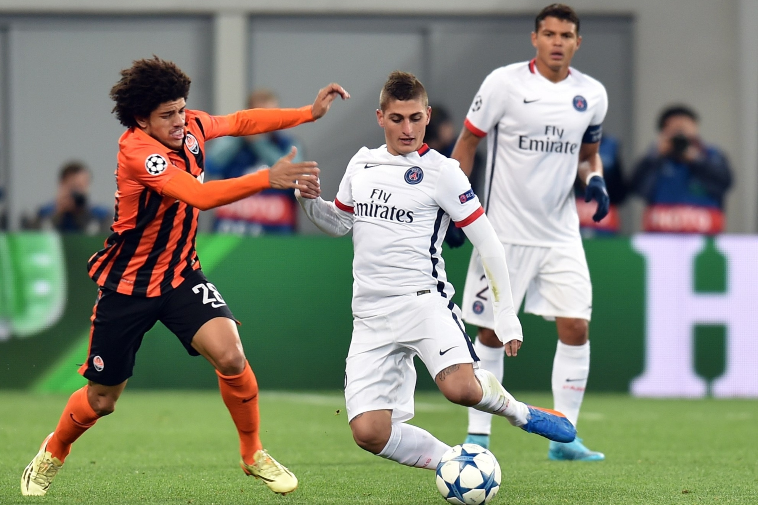 Shakhtar Donetsk's Brazilian midfielder Taison (L) vies with Paris Saint-Germain's Italian midfielder Marco Verratti during the UEFA Champions League group A football match between Shakhtar Donetsk and Paris Saint-Germain at the Arena Lviv, in the Ukraini