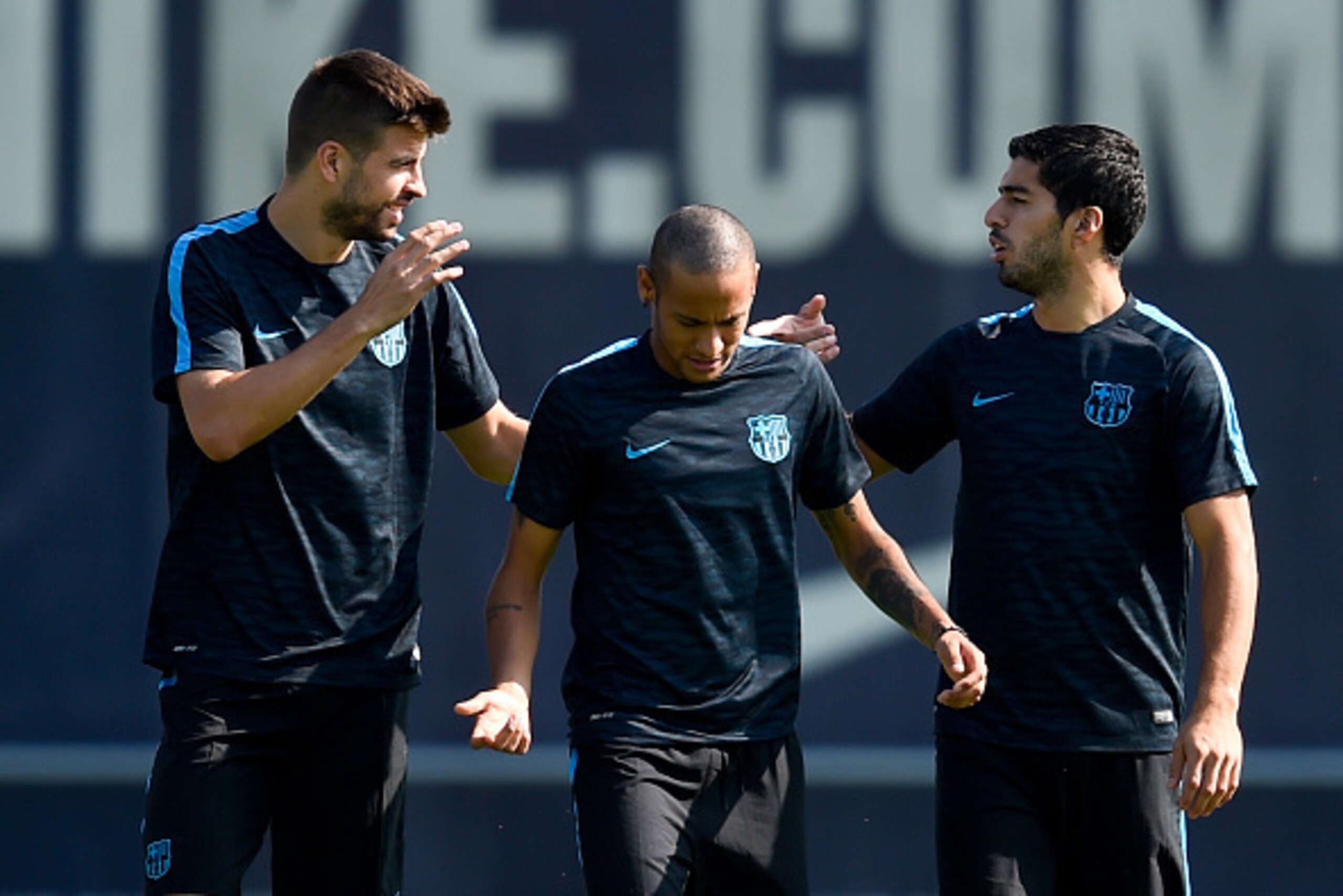 BARCELONA, SPAIN - SEPTEMBER 28: (L-R) Gerard Pique, Neymar and Luis Suarez of FC Barcelona talk during a training session ahead of their UEFA Champions League Group E match against Bayern 04 Leverkusen at Ciutat Esportiva on September 28, 2015 in Barcelo