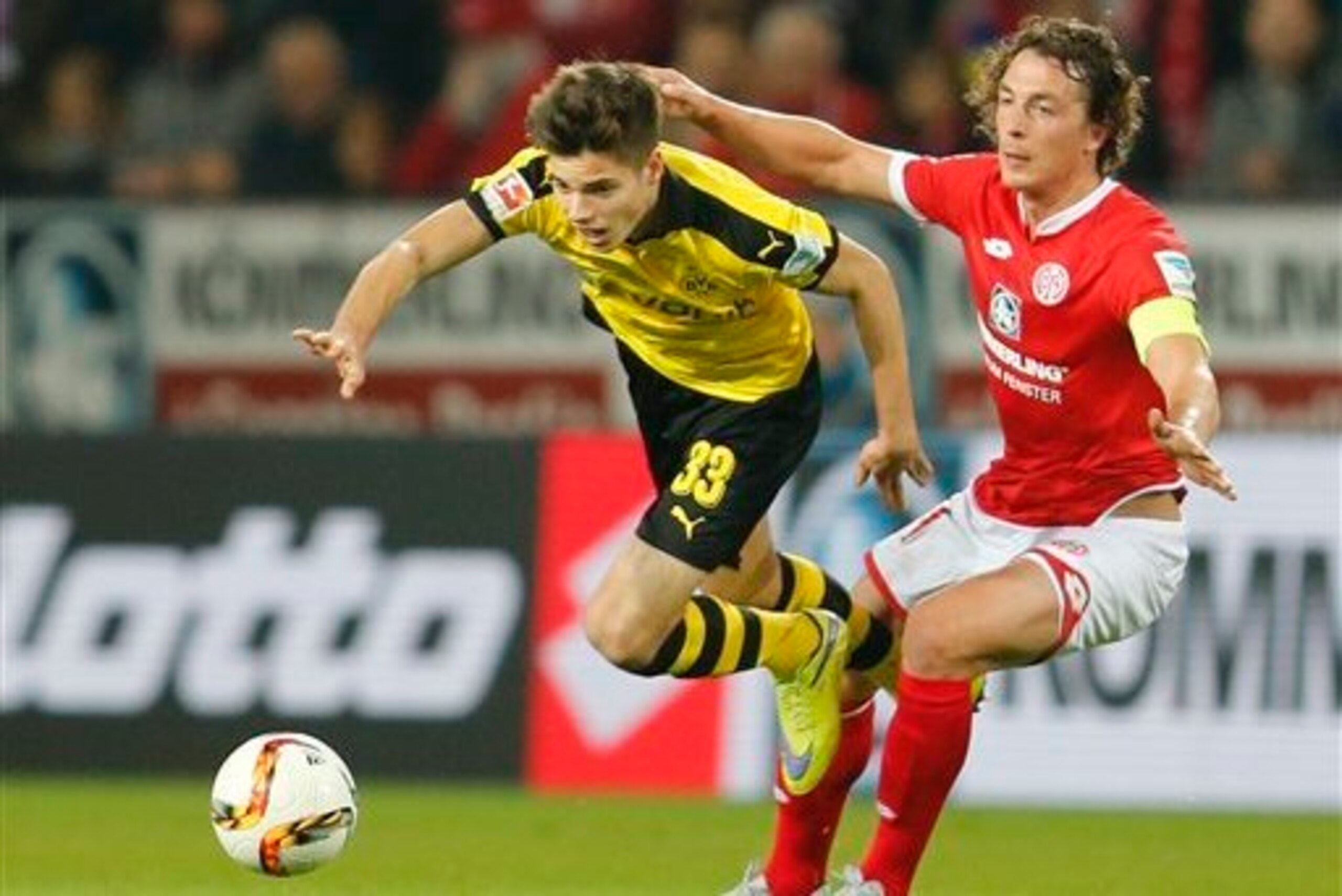 Weigl, pictured in a duel with Mainz's Julian Baumgartlinger, is among Dortmund's most important players at just 20 years of age.