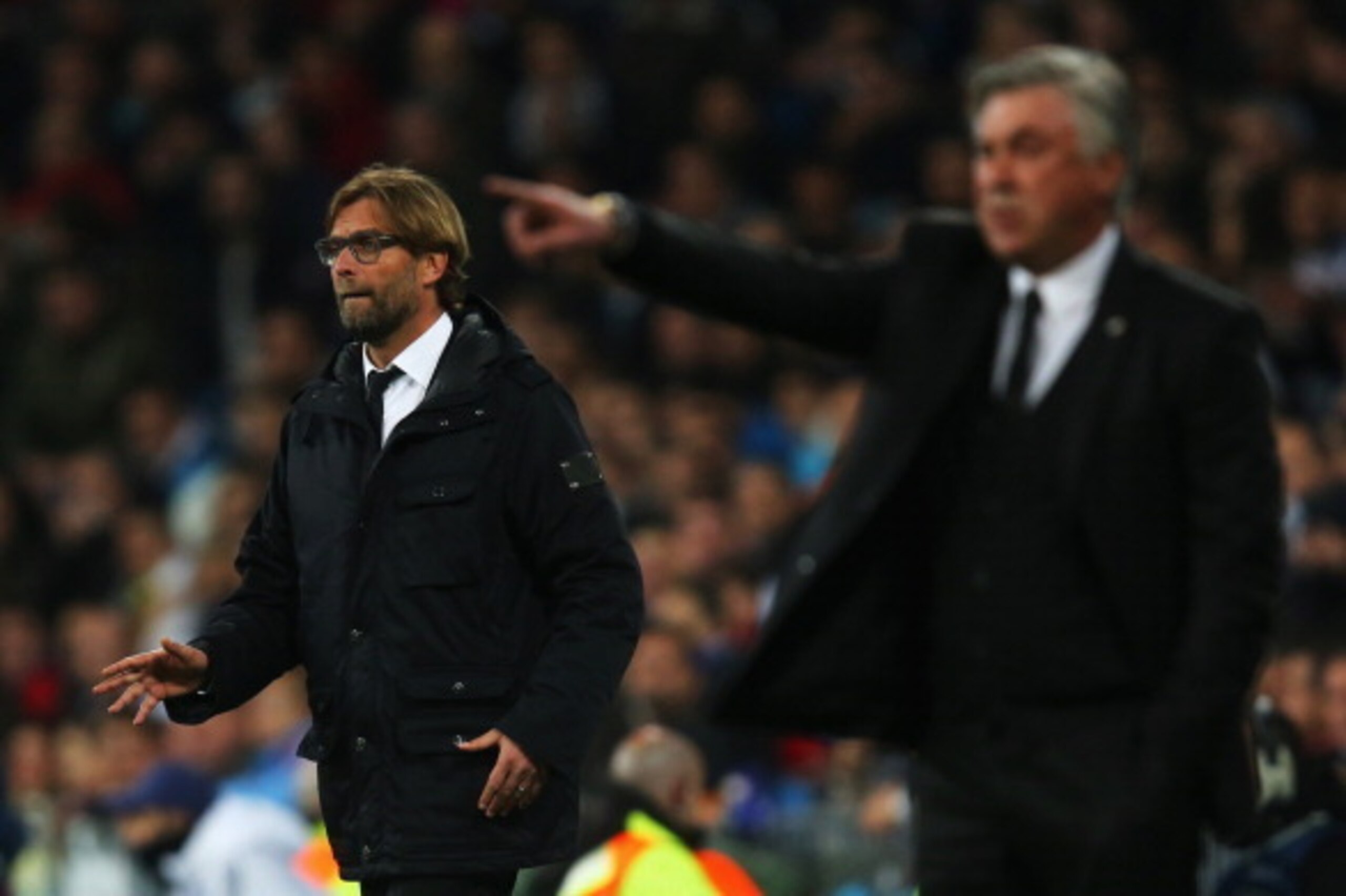 MADRID, SPAIN - APRIL 02:  Juergen Klopp, Coach of Borussia Dortmund looks on with Carlo Ancelotti, coach of Real Madrid during the UEFA Champions League Quarter Final first leg match between Real Madrid and Borussia Dortmund at Estadio Santiago Bernabeu 