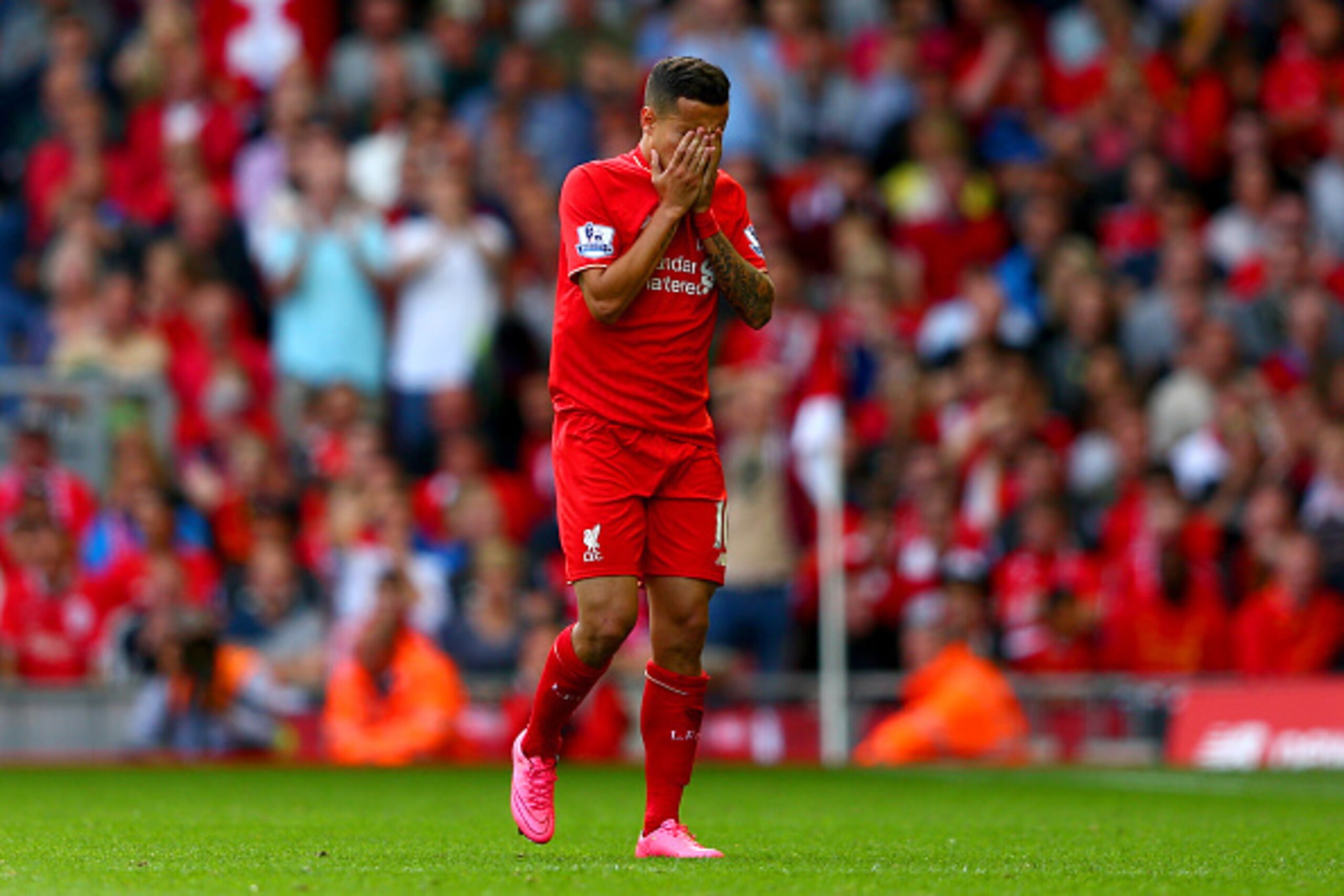 LIVERPOOL, ENGLAND - AUGUST 29: Philippe Coutinho of Liverpool walks off the pitch after receiving a red card during the Barclays Premier League match between Liverpool and West Ham United at Anfield on August 29, 2015 in Liverpool, England.  (Photo by Cl