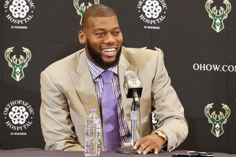 ST. FRANCIS, WI - JULY 9: Recently signed free agents Greg Monroe and Khris Middleton of the Milwaukee Bucks are joined by general manager John Hammond and head coach Jason Kidd during a press conference at the Orthopaedic Hospital of Wisconsin Training C