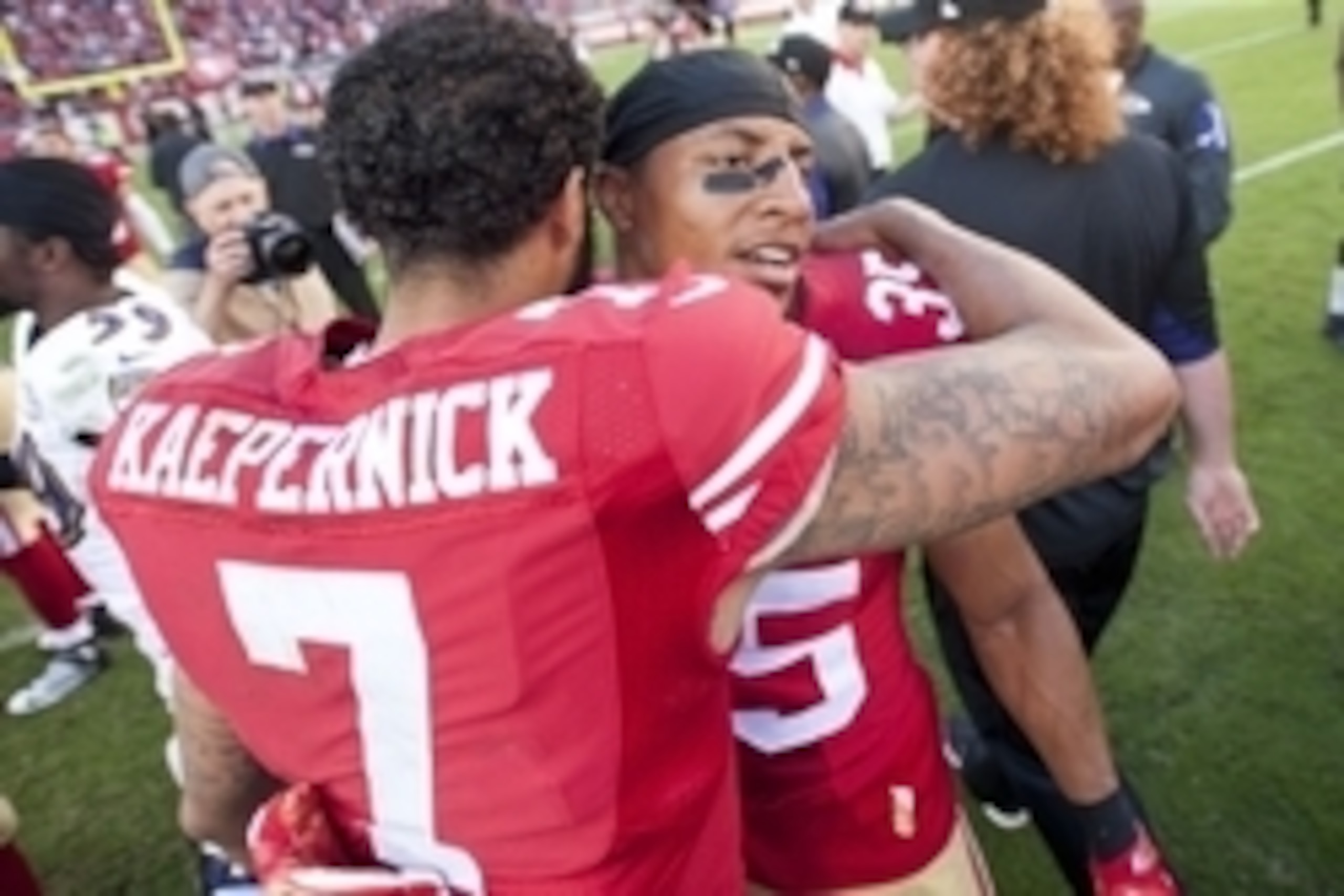 Oct 18, 2015; Santa Clara, CA, USA; San Francisco 49ers quarterback Colin Kaepernick (7) hugs free safety Eric Reid (35) after the game against the Baltimore Ravens at Levi's Stadium. The 49ers defeated the Ravens 25-20. Mandatory Credit: Ed Szczepanski-U