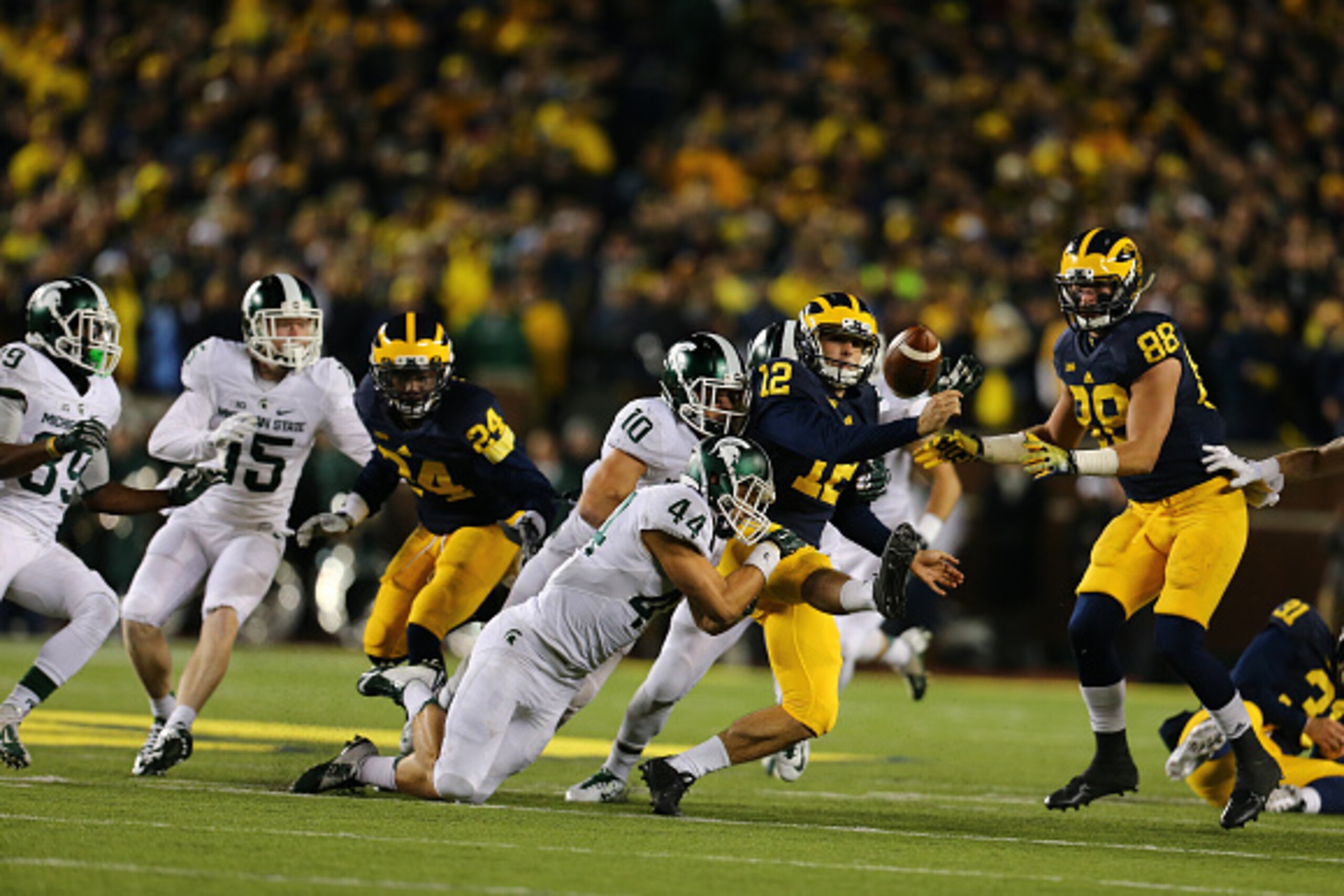 ANN ARBOR, MI - OCTOBER 17: Alex Malzone #12 of the Michigan Wolverines fumbles late in the fourth quarter at Michigan Stadium on October 17, 2015 in East Lansing, Michigan. (Photo by Rey Del Rio/Getty Images) ANN ARBOR, MI - OCTOBER 17: Alex Malzone #12 of the Michigan Wolverines fumbles late in the fourth quarter at Michigan Stadium on October 17, 2015 in East Lansing, Michigan. (Photo by Rey Del Rio/Getty Images)