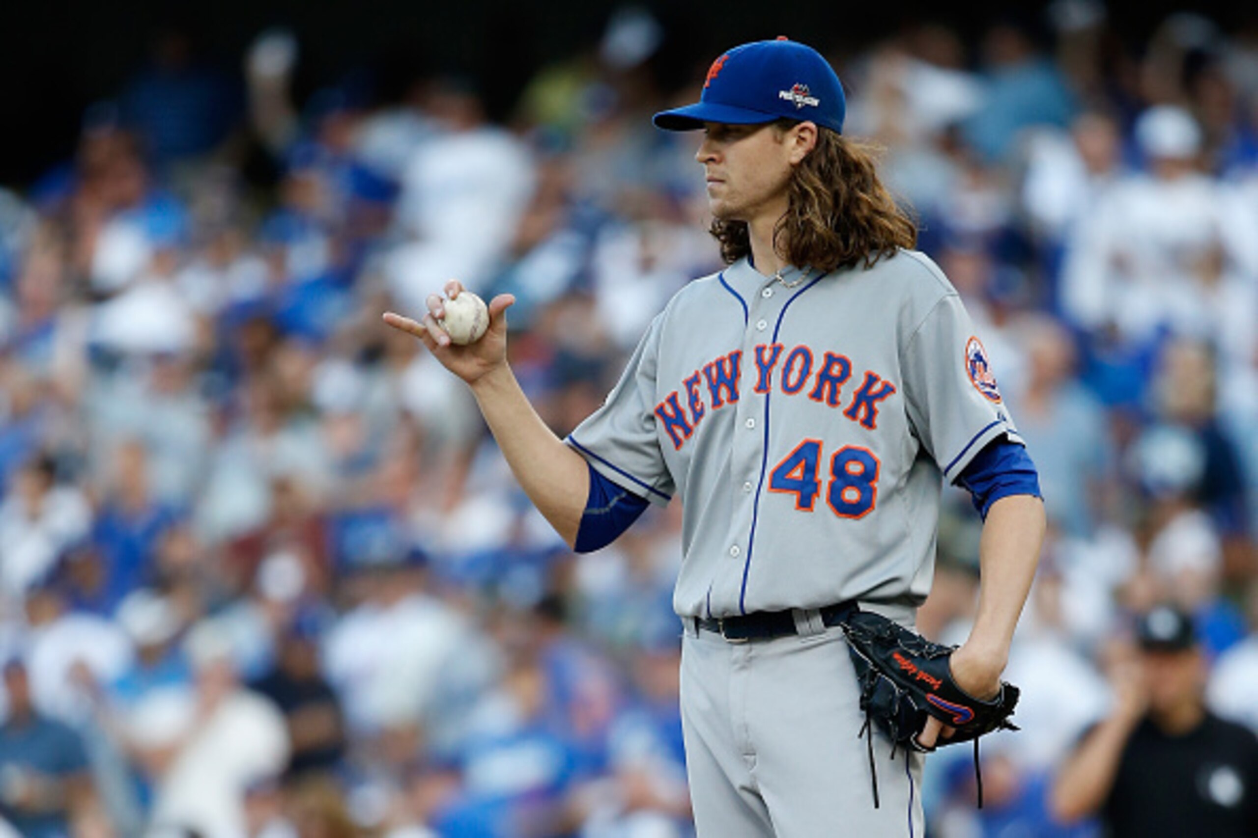 LOS ANGELES, CA - OCTOBER 15: Jacob deGrom #48 of the New York Mets reacts in the first inning against the Los Angeles Dodgers in game five of the National League Division Series at Dodger Stadium on October 15, 2015 in Los Angeles, California. (Photo b LOS ANGELES, CA - OCTOBER 15: Jacob deGrom #48 of the New York Mets reacts in the first inning against the Los Angeles Dodgers in game five of the National League Division Series at Dodger Stadium on October 15, 2015 in Los Angeles, California. (Photo b