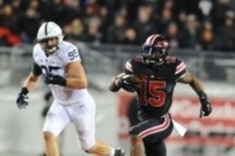 Oct 17, 2015; Columbus, OH, USA; Ohio State Buckeyes running back Ezekiel Elliott (15) carries the ball as Penn State Nittany Lions defensive end Carl Nassib (95) defends in the fourth quarter at Ohio Stadium. Mandatory Credit: James Lang-USA TODAY Sports