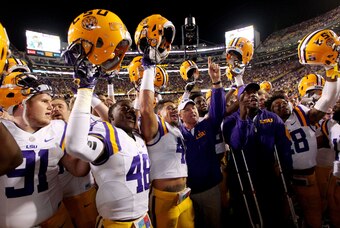 Oct 17, 2015; Baton Rouge, LA, USA; LSU Tigers head coach Les Miles and the Tigers celebrate their 35-28 victory agains the Florida Gators at Tiger Stadium. Mandatory Credit: Crystal LoGiudice-USA TODAY Sports