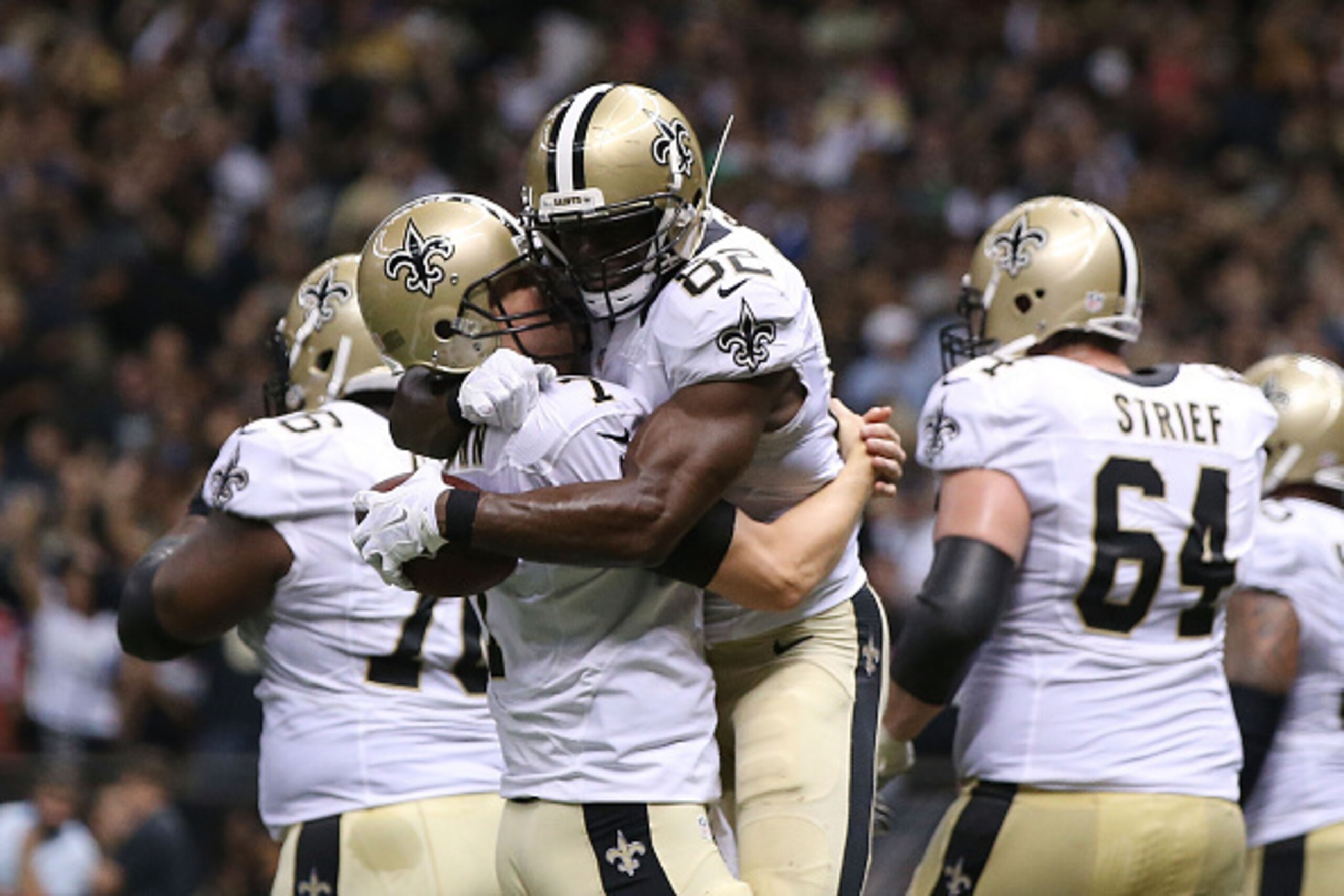 NEW ORLEANS, LA - OCTOBER 15:  Benjamin Watson #82 is congratulated by Luke McCown #7 of the New Orleans Saints following a touchdown during the third quarter of a game against the Atlanta Falcons at the Mercedes-Benz Superdome on October 15, 2015 in New 