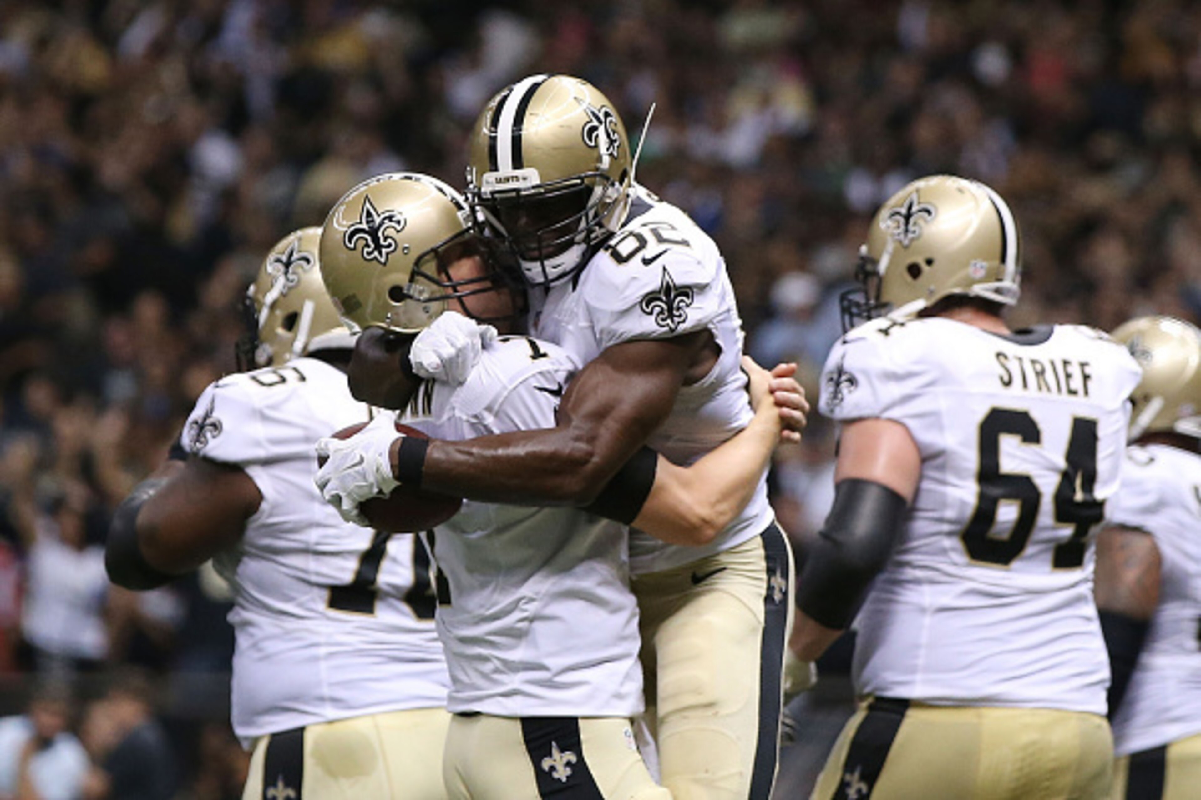 NEW ORLEANS, LA - OCTOBER 15:  Benjamin Watson #82 is congratulated by Luke McCown #7 of the New Orleans Saints following a touchdown during the third quarter of a game against the Atlanta Falcons at the Mercedes-Benz Superdome on October 15, 2015 in New 