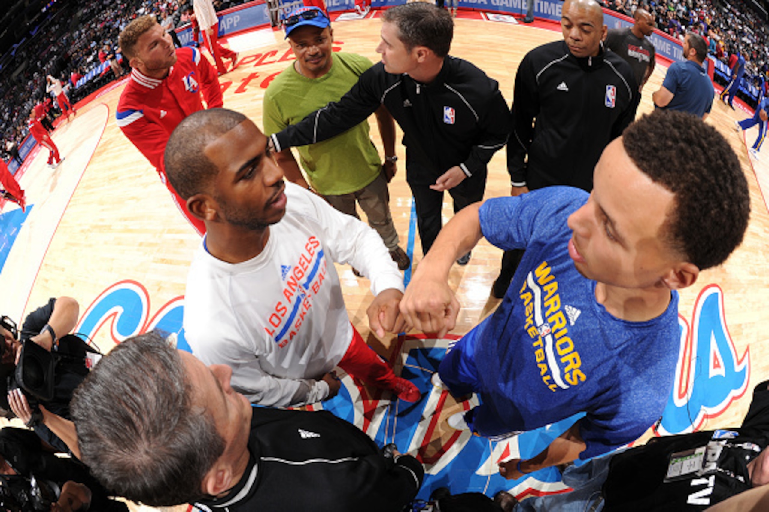 LOS ANGELES, CA - MARCH 31: Chris Paul #3 of the Los Angeles Clippers and Stephen Curry #30 of the Golden State Warriors meet for the pre game captains meeting at STAPLES Center on March 31, 2015 in Los Angeles, California. NOTE TO USER: User expressly ac