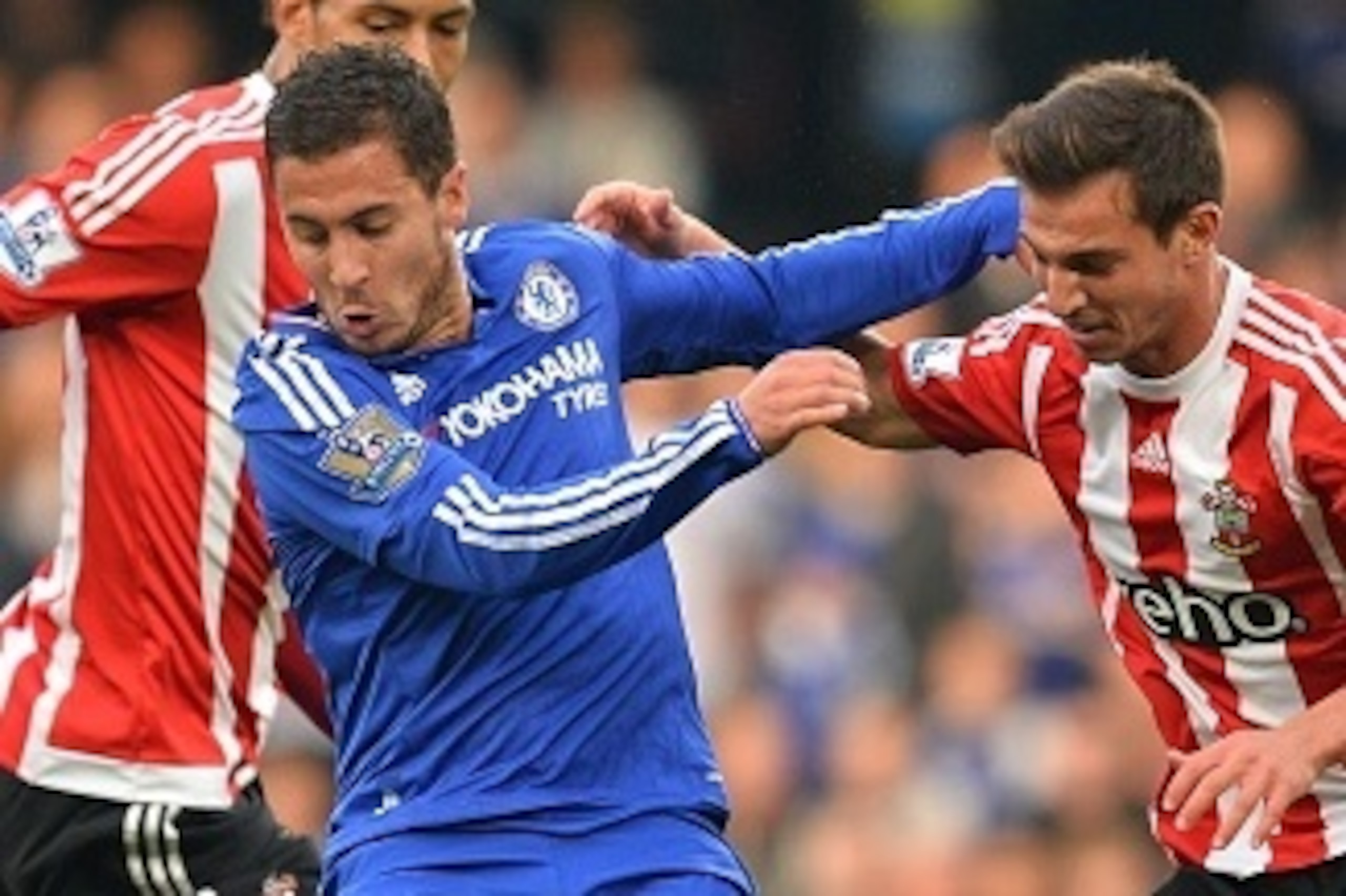 Chelsea's Belgian midfielder Eden Hazard (2nd L) vies with Southampton's German-born Portuguese defender Cedric Soares (R) during the English Premier League football match between Chelsea and Southampton at Stamford Bridge in London on October 3, 2015. AF