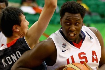 DUBAI, UNITED ARAB EMIRATES - AUGUST 12:  Caleb Swanigan of the United States drives the ball against Yuta Kono of Japan during the FIBA U17 World Championships Group Match between Japan and United States of America at Al Shabab Club on August 12, 2014 in