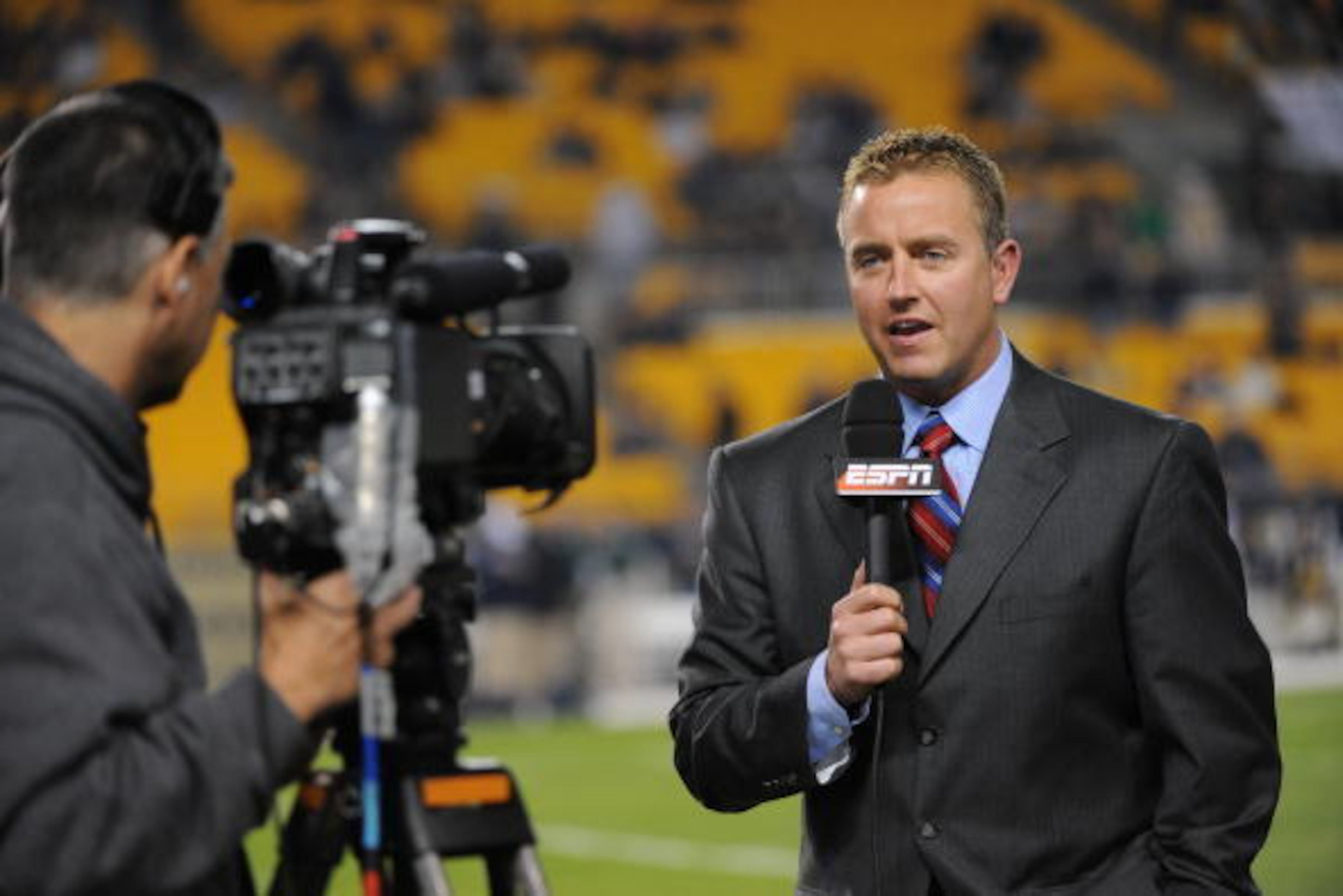 PITTSBURGH - NOVEMBER 14: ESPN college football analyst Kirk Herbstreit reports from the sideline before a game between the Notre Dame Fighting Irish and University of Pittsburgh Panthers at Heinz Field on November 14, 2009 in Pittsburgh, Pennsylvania. PITTSBURGH - NOVEMBER 14: ESPN college football analyst Kirk Herbstreit reports from the sideline before a game between the Notre Dame Fighting Irish and University of Pittsburgh Panthers at Heinz Field on November 14, 2009 in Pittsburgh, Pennsylvania.