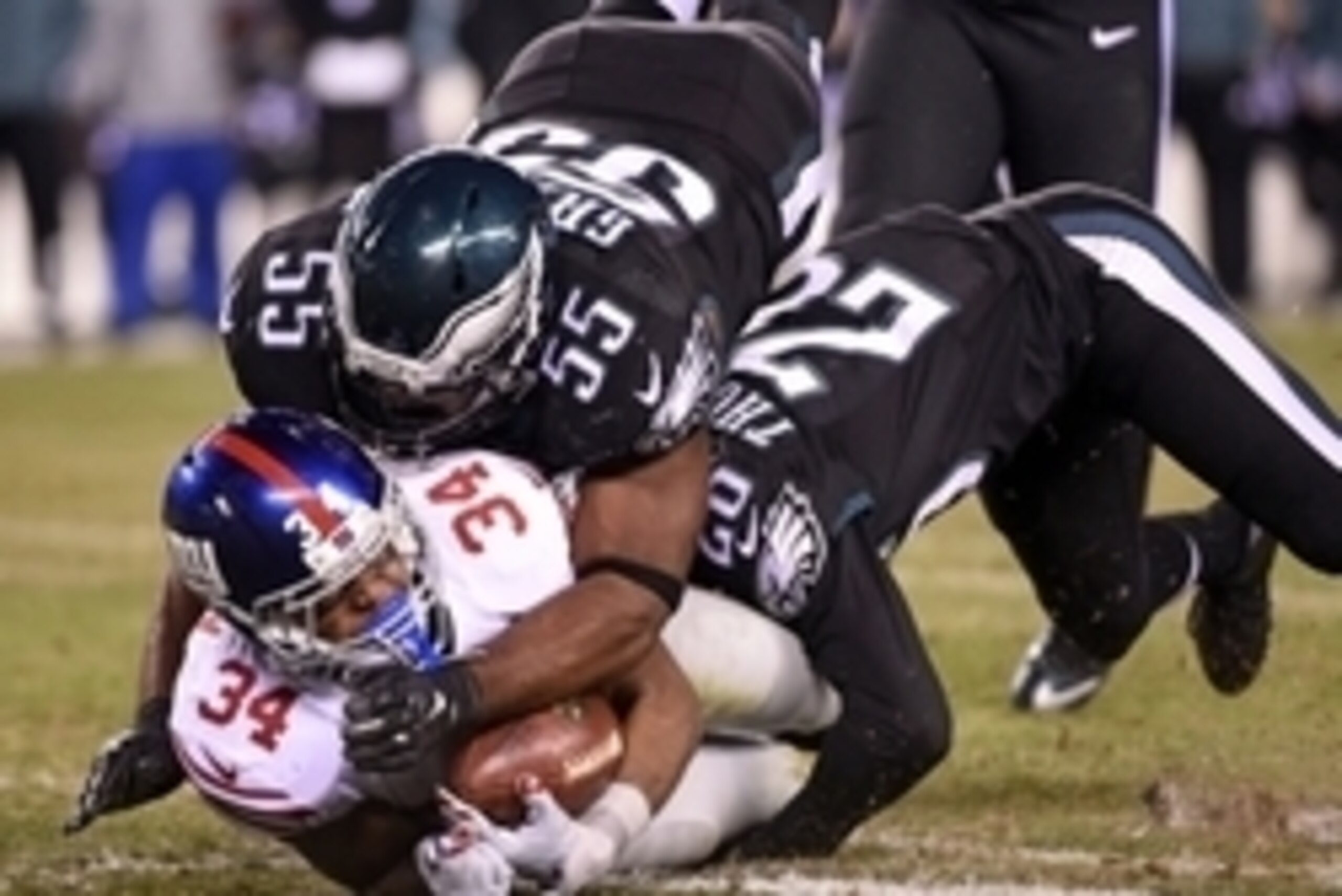Oct 19, 2015; Philadelphia, PA, USA; Philadelphia Eagles strong safety Walter Thurmond (26) and outside linebacker Brandon Graham (55) tackle New York Giants running back Shane Vereen (34) at Lincoln Financial Field. The Eagles defeated the Giants, 27-7. 