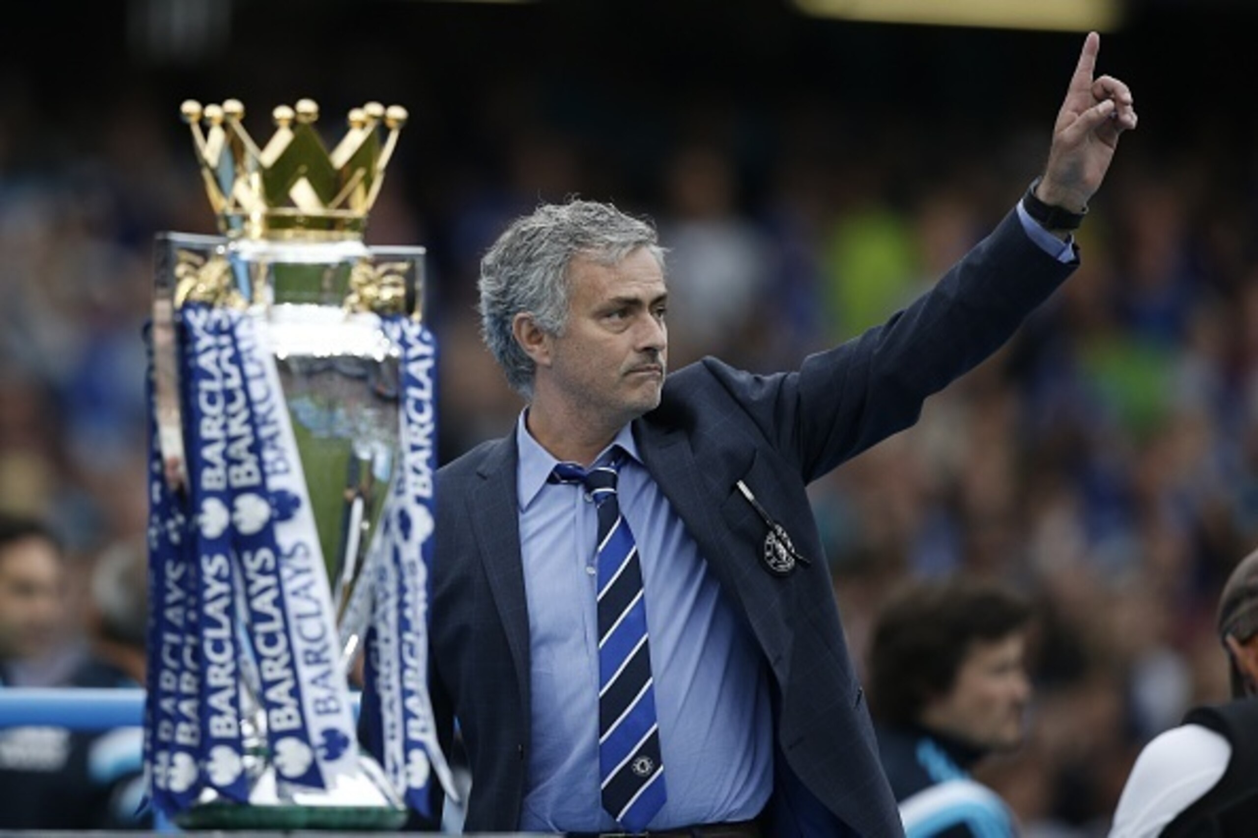 Chelsea's Portuguese manager Jose Mourinho (R) gestures during the presentation of the Premier League trophy after the English Premier League football match between Chelsea and Sunderland at Stamford Bridge in London on May 24, 2015. Chelsea were official Chelsea's Portuguese manager Jose Mourinho (R) gestures during the presentation of the Premier League trophy after the English Premier League football match between Chelsea and Sunderland at Stamford Bridge in London on May 24, 2015. Chelsea were official