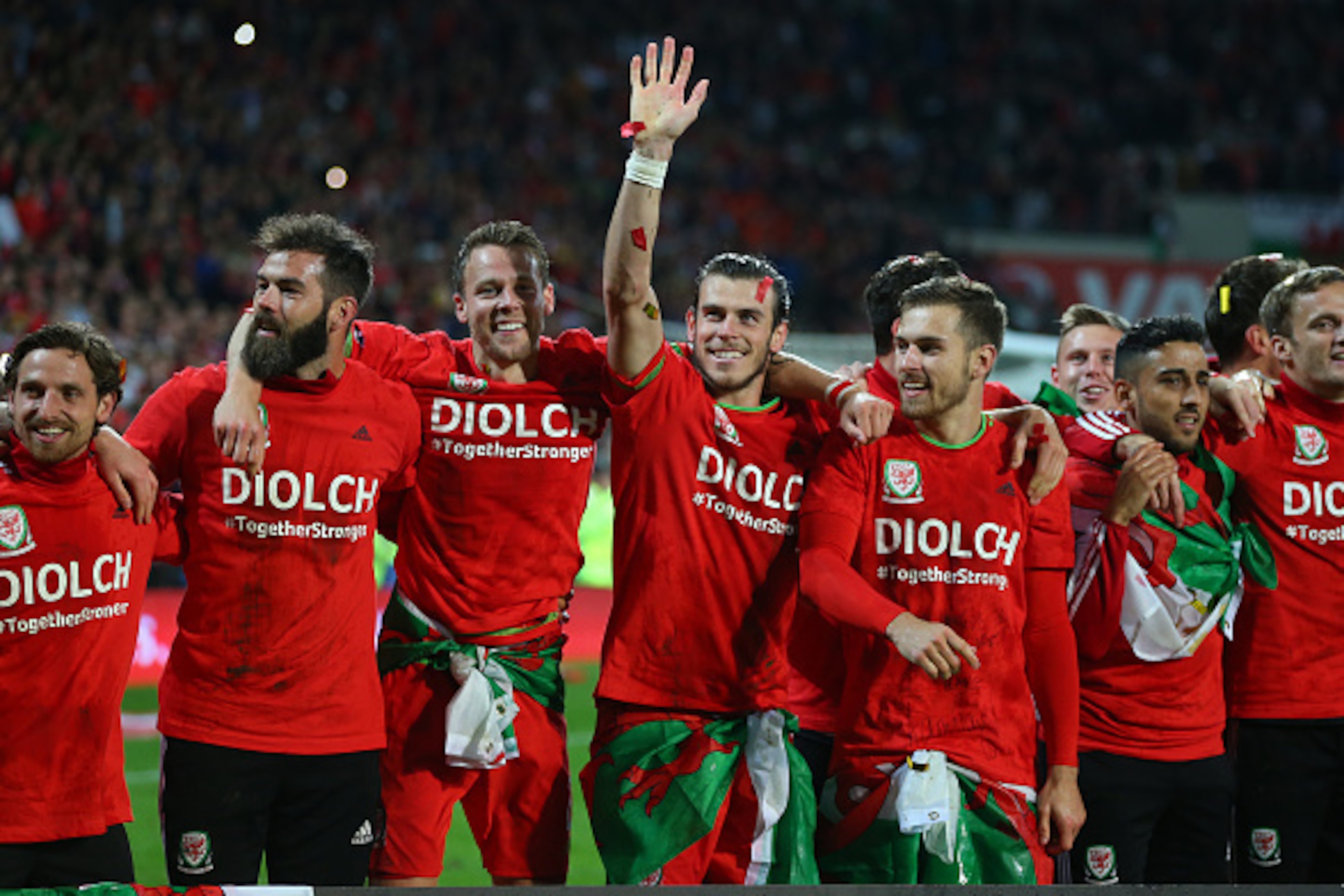 CARDIFF, WALES - OCTOBER 13 : Gareth Bale of Wales waves as he celebrates alongside team mates Joe Ledley, Chris Gunter and Aaron Ramsey of Wales after the UEFA EURO 2016 Qualifier match between Wales and Andorra at Cardiff City Stadium on October 13, 201