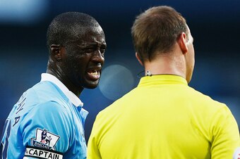 MANCHESTER, ENGLAND - SEPTEMBER 19: Yaya Toure of Manchester City talks with referee Robert Madley during the Barclays Premier League match between Manchester City and West Ham United at Etihad Stadium on September 19, 2015 in Manchester, United Kingdom. 