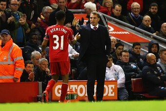 LIVERPOOL, ENGLAND - APRIL 13:  Brendan Rodgers manager of Liverpool shakes hands with Raheem Sterling of Liverpool as he is substituted during the Barclays Premier League match between Liverpool and Newcastle United at Anfield on April 13, 2015 in Liverp